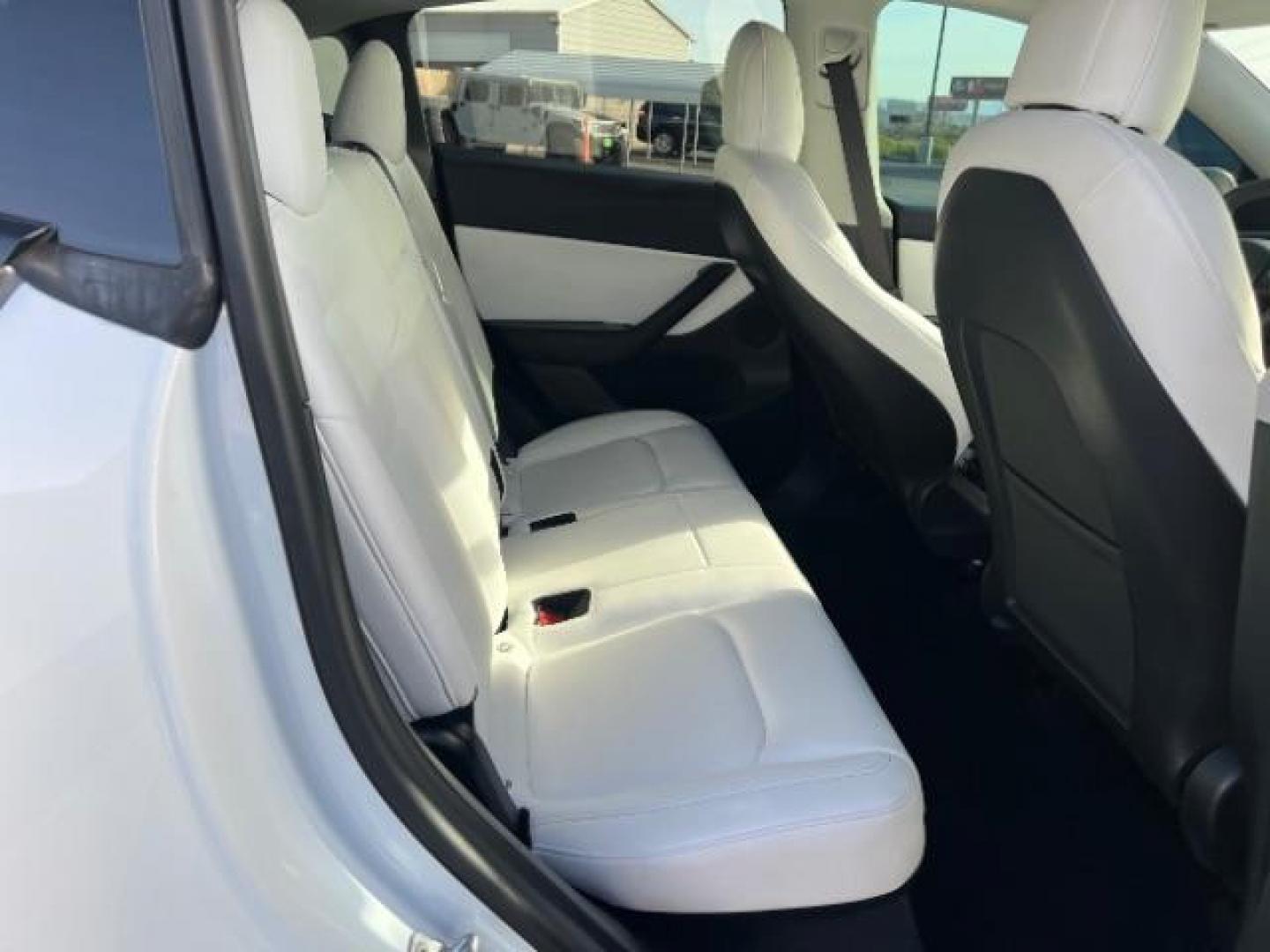 2021 White /White/Black Tesla Model Y Long Range Dual Motor All-Wheel Drive (5YJYGDEE5MF) with an ELECTRIC engine, Electric transmission, located at 1865 East Red Hills Pkwy, St. George, 84770, (435) 628-0023, 37.120850, -113.543640 - Excellent Tesla Model Y Long Range All Wheel Drive. With Full Self Drive paid for ($8k add on) Which is no longer available to buy. All our Teslas come with charging kit. Color changing wrap is a little rough but will still turn heads. Battery is healthy. Gets 275 on full charge. Clean title, no a - Photo#26