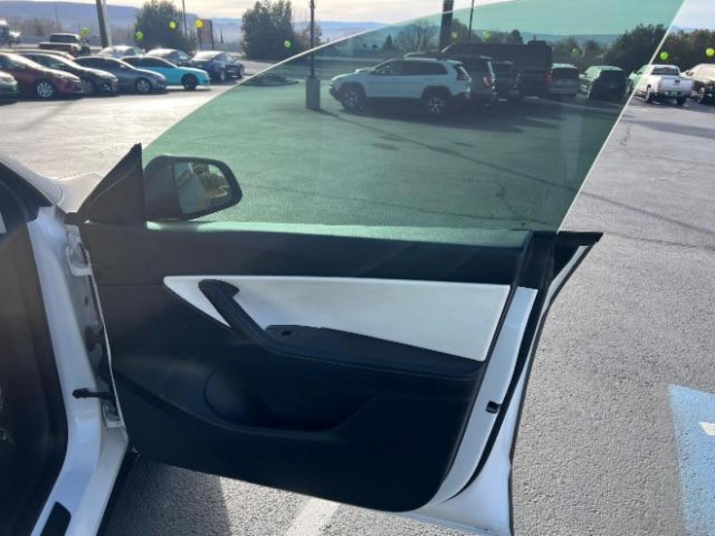 2021 White /White/Black Tesla Model Y Long Range Dual Motor All-Wheel Drive (5YJYGDEE5MF) with an ELECTRIC engine, Electric transmission, located at 1865 East Red Hills Pkwy, St. George, 84770, (435) 628-0023, 37.120850, -113.543640 - Excellent Tesla Model Y Long Range All Wheel Drive. With Full Self Drive paid for ($8k add on) Which is no longer available to buy. All our Teslas come with charging kit. Color changing wrap is a little rough but will still turn heads. Battery is healthy. Gets 275 on full charge. Clean title, no a - Photo#27