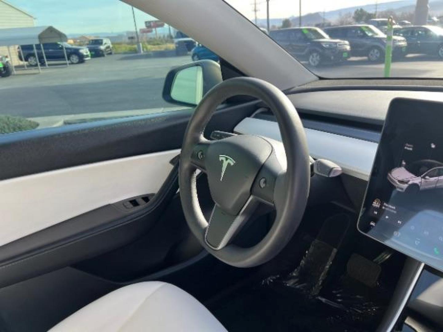 2021 White /White/Black Tesla Model Y Long Range Dual Motor All-Wheel Drive (5YJYGDEE5MF) with an ELECTRIC engine, Electric transmission, located at 1865 East Red Hills Pkwy, St. George, 84770, (435) 628-0023, 37.120850, -113.543640 - Excellent Tesla Model Y Long Range All Wheel Drive. With Full Self Drive paid for ($8k add on) Which is no longer available to buy. All our Teslas come with charging kit. Color changing wrap is a little rough but will still turn heads. Battery is healthy. Gets 275 on full charge. Clean title, no a - Photo#29