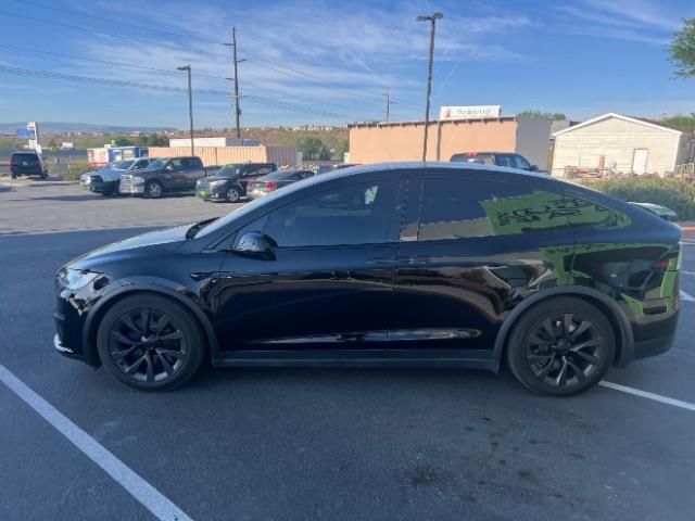 2024 Solid Black /Black Tesla Model X Long Range (7SAXCBE55RF) with an ELECTRIC engine, Electric transmission, located at 1865 East Red Hills Pkwy, St. George, 84770, (435) 628-0023, 37.120850, -113.543640 - Excellent Tesla Model X Long Range All Wheel Drive. With 3rd row 6 Seats, HW4, Homelink, Tow hitch, 20' WheelsLow miles and in near new condition. All our Teslas come with charging kit. Battery is healthy. Gets 300 on full charge. Clean title, no accidents, 1 Owner. Still has remaining Bumper 2 - Photo#5
