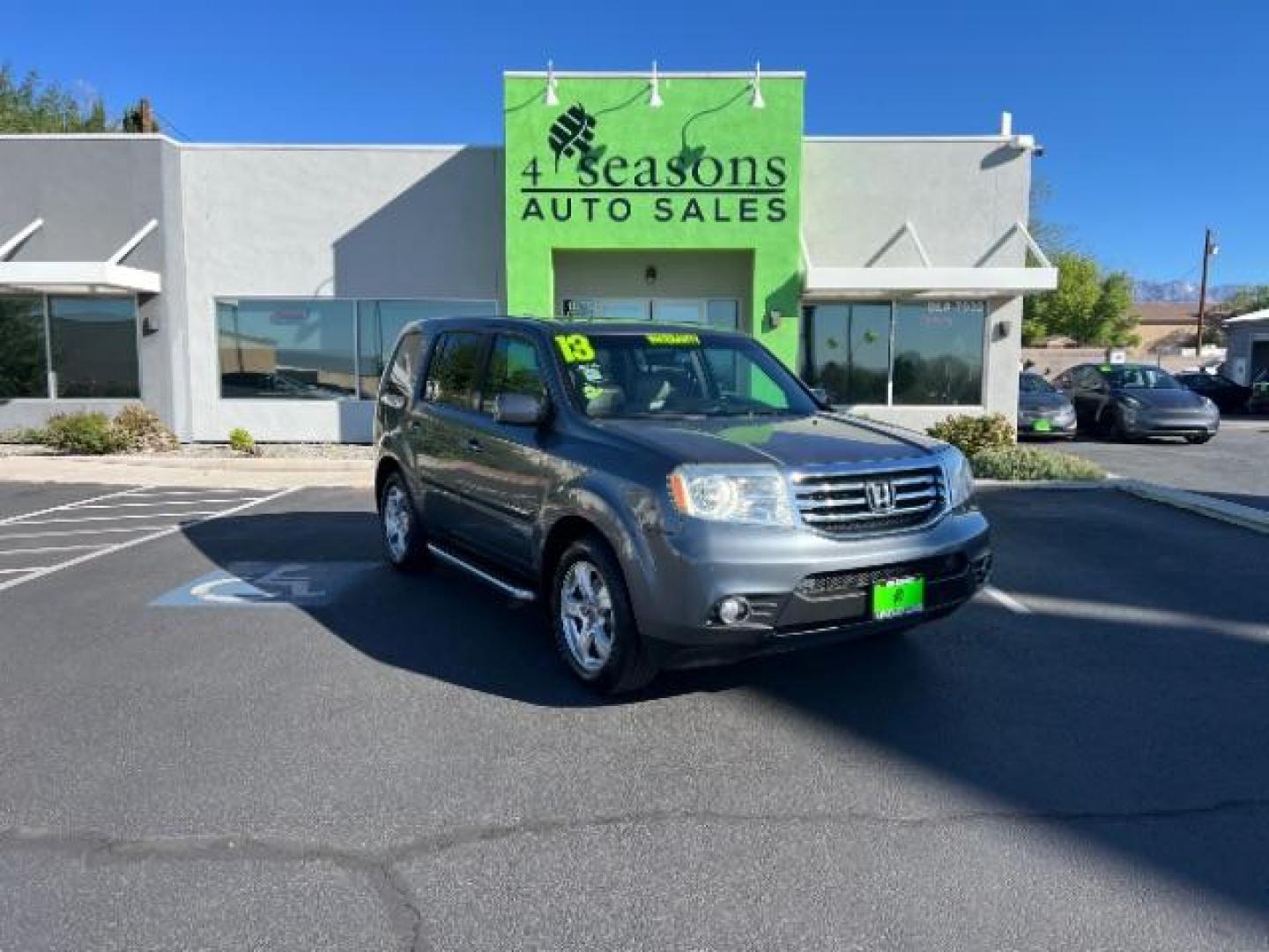 2013 Polished Metal Metallic /Gray Honda Pilot EX-L (5FNYF3H5XDB) with an 3.5L V-6 i-VTEC VCM variable valve control engine, Automatic transmission, located at 1865 East Red Hills Pkwy, St. George, 84770, (435) 628-0023, 37.120850, -113.543640 - We specialize in helping ALL people get the best financing available. No matter your credit score, good, bad or none we can get you an amazing rate. Had a bankruptcy, divorce, or repossessions? We give you the green light to get your credit back on the road. Low down and affordable payments that fit- Photo#0