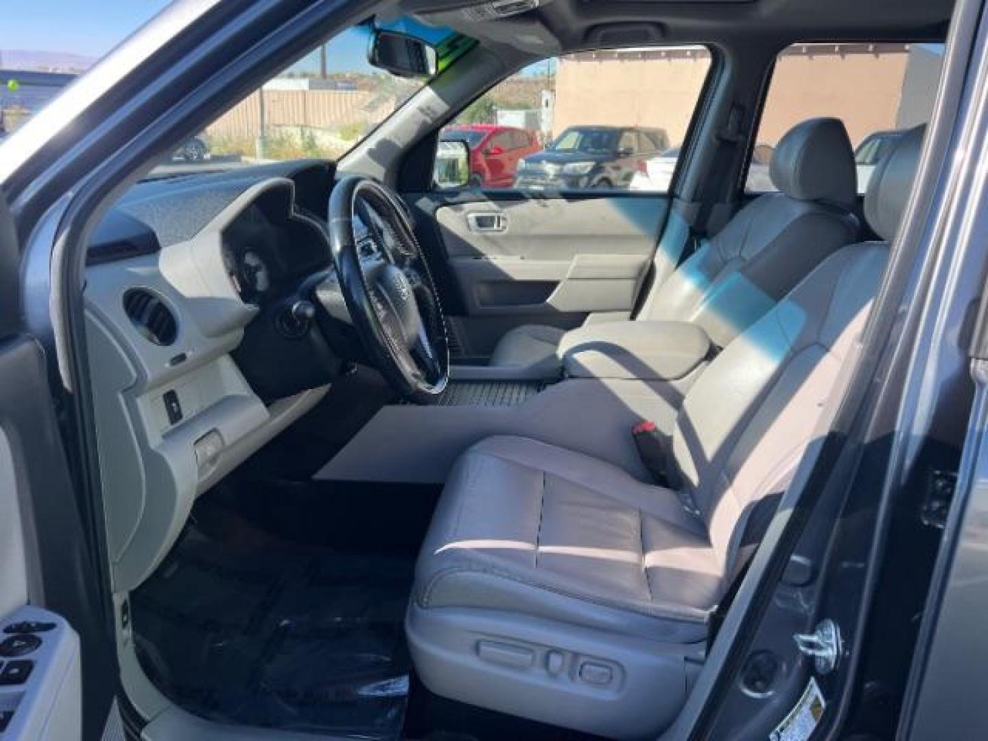 2013 Polished Metal Metallic /Gray Honda Pilot EX-L (5FNYF3H5XDB) with an 3.5L V-6 i-VTEC VCM variable valve control engine, Automatic transmission, located at 1865 East Red Hills Pkwy, St. George, 84770, (435) 628-0023, 37.120850, -113.543640 - We specialize in helping ALL people get the best financing available. No matter your credit score, good, bad or none we can get you an amazing rate. Had a bankruptcy, divorce, or repossessions? We give you the green light to get your credit back on the road. Low down and affordable payments that fit- Photo#14
