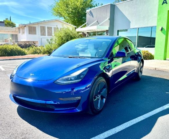 2022 Deep Blue Metallic /White/Black Tesla Model 3 Long Range Dual Motor All-Wheel Drive (5YJ3E1EB7NF) with an ELECTRIC engine, Electric transmission, located at 1865 East Red Hills Pkwy, St. George, 84770, (435) 628-0023, 37.120850, -113.543640 - Excellent Tesla Model 3 Long Range All Wheel Drive with White interior! HW3. Inside and outside in great shape. Tires are good. All our Teslas come with charging kit. Battery is near new. Gets 305 on full charge. Clean title, no accidents Still has remaining 120k mile Tesla warranty on battery a - Photo#1