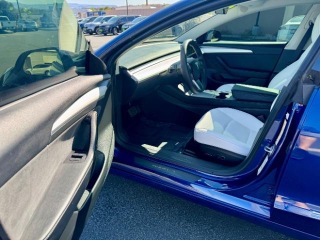 2022 Deep Blue Metallic /White/Black Tesla Model 3 Long Range Dual Motor All-Wheel Drive (5YJ3E1EB7NF) with an ELECTRIC engine, Electric transmission, located at 1865 East Red Hills Pkwy, St. George, 84770, (435) 628-0023, 37.120850, -113.543640 - Excellent Tesla Model 3 Long Range All Wheel Drive with White interior! HW3. Inside and outside in great shape. Tires are good. All our Teslas come with charging kit. Battery is near new. Gets 305 on full charge. Clean title, no accidents Still has remaining 120k mile Tesla warranty on battery a - Photo#9