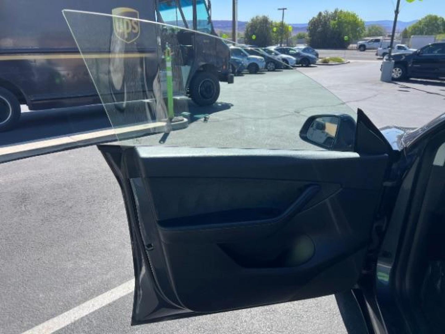 2021 Midnight Silver Metallic /Black Tesla Model Y Long Range Dual Motor All-Wheel Drive (5YJYGDEE0MF) with an ELECTRIC engine, Electric transmission, located at 1865 East Red Hills Pkwy, St. George, 84770, (435) 628-0023, 37.120850, -113.543640 - Excellent Tesla Model Y Long Range All Wheel Drive with Full Self Driving Paid for. Thats a $8k add on that is no longer avilable from Tesla. HW3. Inside and outside in great shape. Has PPF on front and Yoke steering wheel. Tires are good. All our Teslas come with charging kit. Battery is healthy. - Photo#14