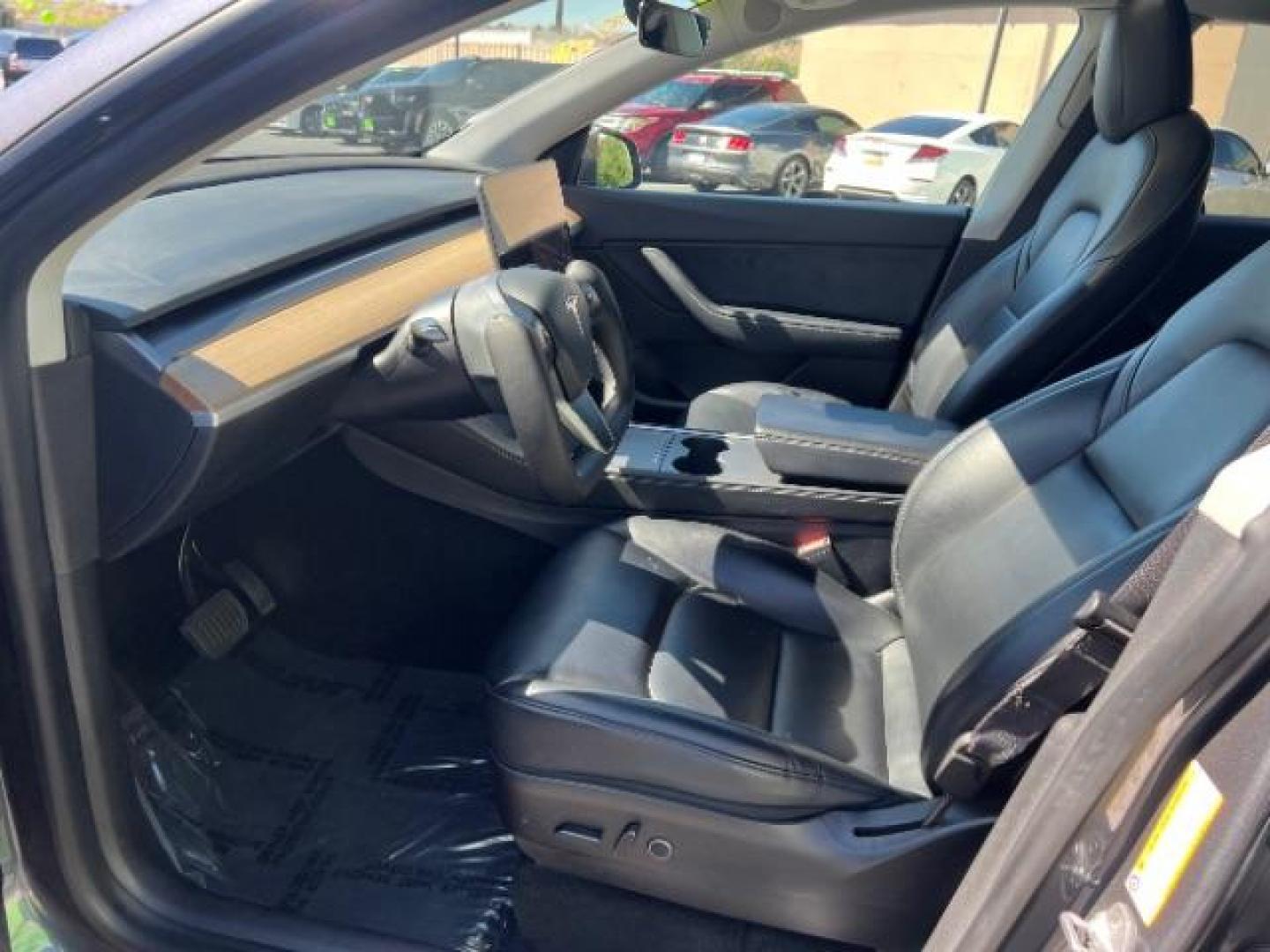 2021 Midnight Silver Metallic /Black Tesla Model Y Long Range Dual Motor All-Wheel Drive (5YJYGDEE0MF) with an ELECTRIC engine, Electric transmission, located at 1865 East Red Hills Pkwy, St. George, 84770, (435) 628-0023, 37.120850, -113.543640 - Excellent Tesla Model Y Long Range All Wheel Drive with Full Self Driving Paid for. Thats a $8k add on that is no longer avilable from Tesla. HW3. Inside and outside in great shape. Has PPF on front and Yoke steering wheel. Tires are good. All our Teslas come with charging kit. Battery is healthy. - Photo#16