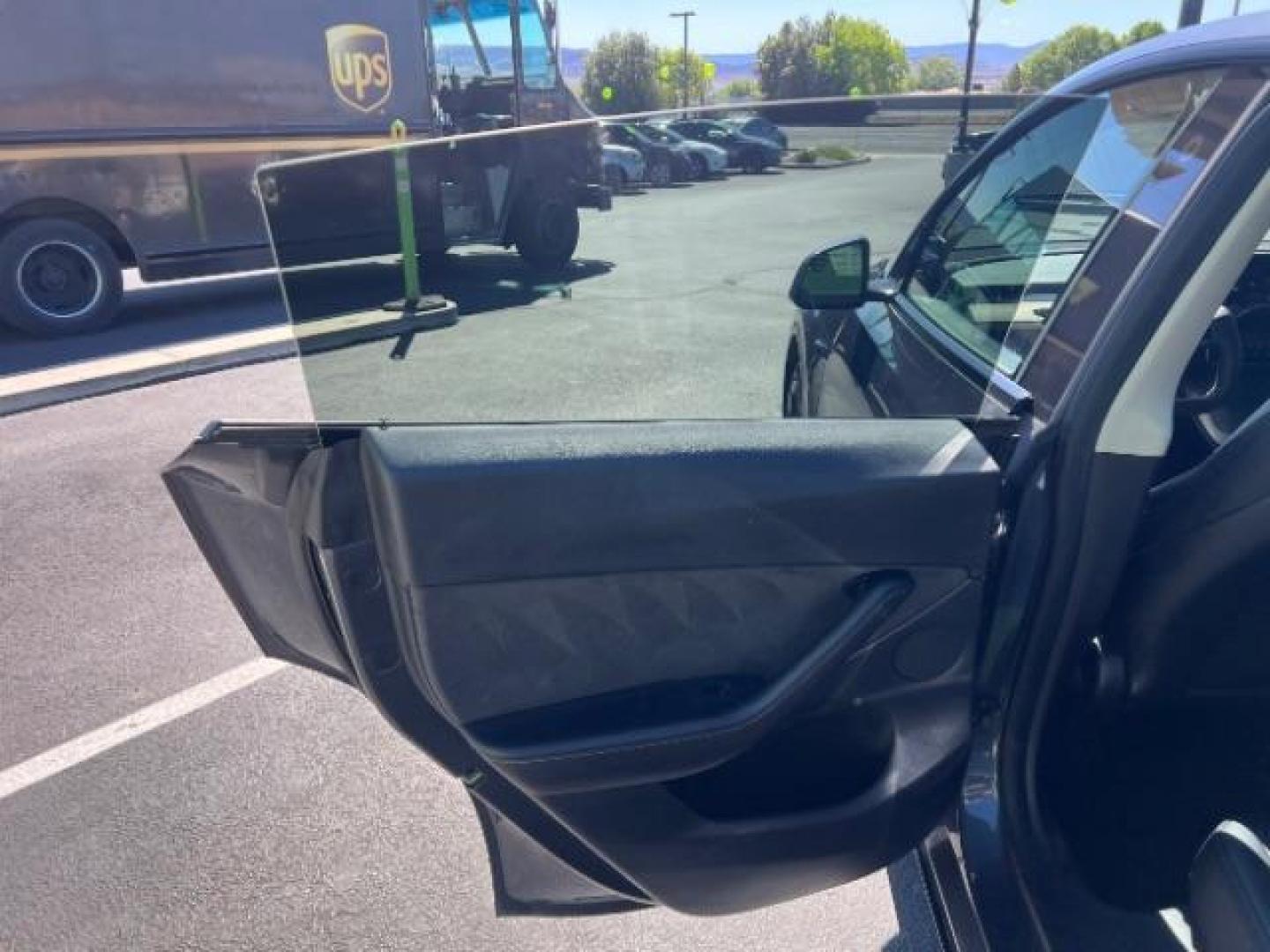 2021 Midnight Silver Metallic /Black Tesla Model Y Long Range Dual Motor All-Wheel Drive (5YJYGDEE0MF) with an ELECTRIC engine, Electric transmission, located at 1865 East Red Hills Pkwy, St. George, 84770, (435) 628-0023, 37.120850, -113.543640 - Excellent Tesla Model Y Long Range All Wheel Drive with Full Self Driving Paid for. Thats a $8k add on that is no longer avilable from Tesla. HW3. Inside and outside in great shape. Has PPF on front and Yoke steering wheel. Tires are good. All our Teslas come with charging kit. Battery is healthy. - Photo#20