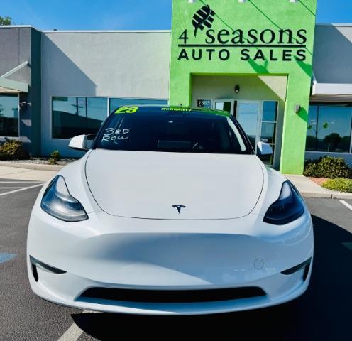 2023 Pearl White Multi-Coat /Black Tesla Model Y Long Range Dual Motor All-Wheel Drive | AWD (7SAYGAEE0PF) with an ELECTRIC engine, Electric transmission, located at 1865 East Red Hills Pkwy, St. George, 84770, (435) 628-0023, 37.120850, -113.543640 - Excellent Tesla Model Y Long Range All Wheel Drive with 3rd row. 7seats. HW3. Inside and outside in great shape. Tires are good. All our Teslas come with charging kit. Battery is healthy. Gets 285 on full charge. Clean title, no accidents Still has remaining 120k mile Tesla warranty on battery a - Photo#0