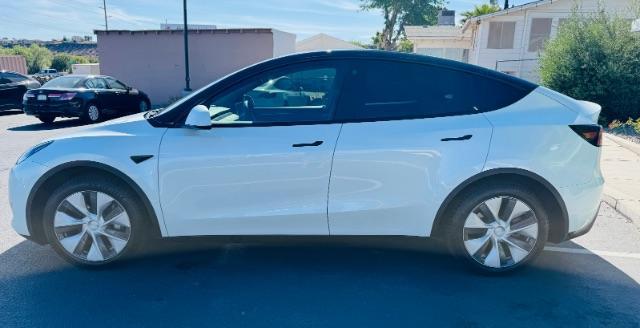 2023 Pearl White Multi-Coat /Black Tesla Model Y Long Range Dual Motor All-Wheel Drive | AWD (7SAYGAEE0PF) with an ELECTRIC engine, Electric transmission, located at 1865 East Red Hills Pkwy, St. George, 84770, (435) 628-0023, 37.120850, -113.543640 - Excellent Tesla Model Y Long Range All Wheel Drive with 3rd row. 7seats. HW3. Inside and outside in great shape. Tires are good. All our Teslas come with charging kit. Battery is healthy. Gets 285 on full charge. Clean title, no accidents Still has remaining 120k mile Tesla warranty on battery a - Photo#2