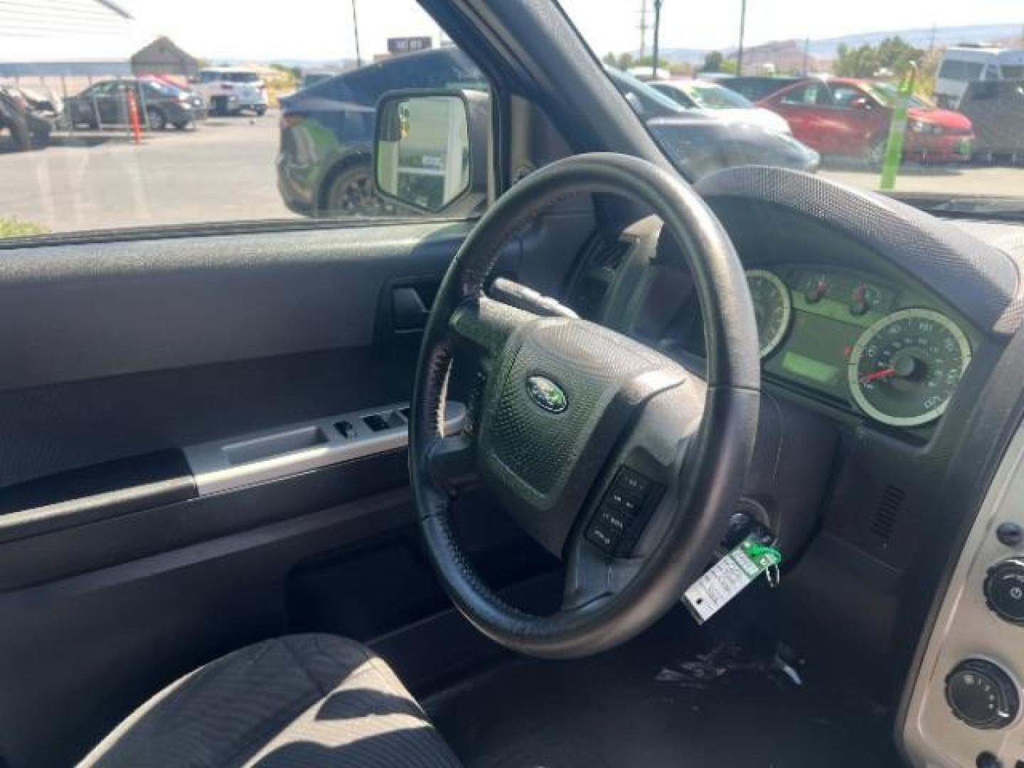 2011 Tuxedo Black Metallic /Stone Ford Escape XLT (1FMCU0D71BK) , Automatic transmission, located at 940 North Main Street, Cedar City, UT, 84720, (435) 628-0023, 37.692936, -113.061897 - We specialize in helping ALL people get the best financing available. No matter your credit score, good, bad or none we can get you an amazing rate. Had a bankruptcy, divorce, or repossessions? We give you the green light to get your credit back on the road. Low down and affordable payments that fit- Photo#29
