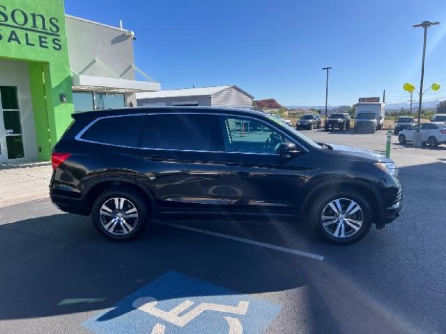 2016 Crystal Black Pearl /Beige Honda Pilot EX-L (5FNYF5H51GB) with an 3.5L V-6 gasoline direct injection engine, Automatic transmission, located at 1865 East Red Hills Pkwy, St. George, 84770, (435) 628-0023, 37.120850, -113.543640 - We specialize in helping ALL people get the best financing available. No matter your credit score, good, bad or none we can get you an amazing rate. Had a bankruptcy, divorce, or repossessions? We give you the green light to get your credit back on the road. Low down and affordable payments that fit - Photo#7