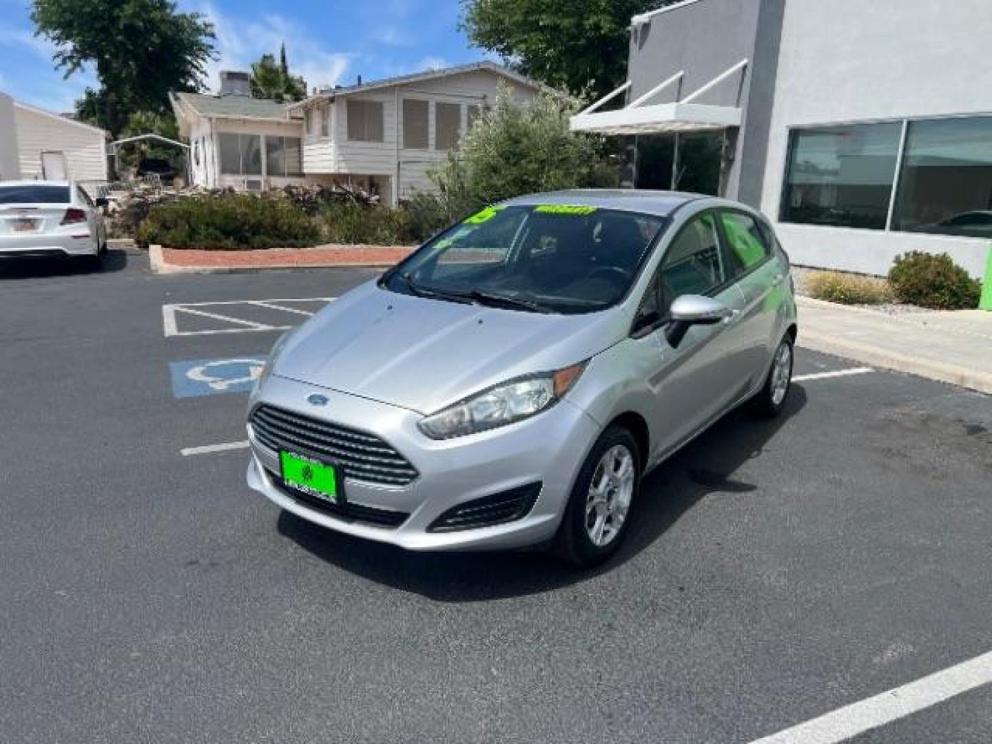 2015 Ingot Silver /Medium Light Stone Ford Fiesta SE (3FADP4EJ4FM) with an EcoBoost 1L I-3 gasoline direct injection engine, Automatic transmission, located at 940 North Main Street, Cedar City, UT, 84720, (435) 628-0023, 37.692936, -113.061897 - Versatile Southern Utah travel starts with this 2015 Ford Fiesta SE hatchback. Its 1.6L 4-cylinder engine, 6-speed automatic transmission, and front-wheel drive make it a smart fit for commuting, errands, and easy city parking. With 102817 miles, this Fiesta is ready for its next adventure. The SE- Photo#2