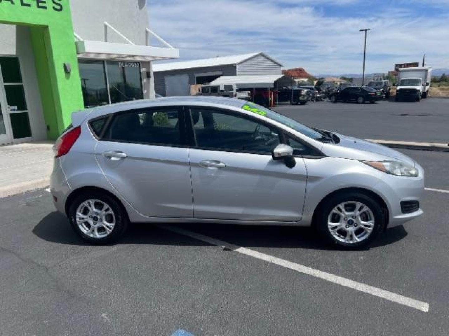 2015 Ingot Silver /Medium Light Stone Ford Fiesta SE (3FADP4EJ4FM) with an EcoBoost 1L I-3 gasoline direct injection engine, Automatic transmission, located at 940 North Main Street, Cedar City, UT, 84720, (435) 628-0023, 37.692936, -113.061897 - Versatile Southern Utah travel starts with this 2015 Ford Fiesta SE hatchback. Its 1.6L 4-cylinder engine, 6-speed automatic transmission, and front-wheel drive make it a smart fit for commuting, errands, and easy city parking. With 102817 miles, this Fiesta is ready for its next adventure. The SE- Photo#7