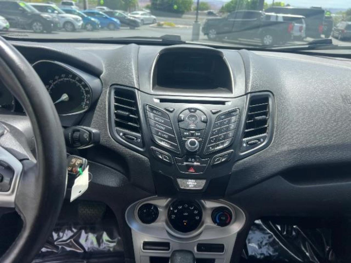 2015 Ingot Silver /Medium Light Stone Ford Fiesta SE (3FADP4EJ4FM) with an EcoBoost 1L I-3 gasoline direct injection engine, Automatic transmission, located at 940 North Main Street, Cedar City, UT, 84720, (435) 628-0023, 37.692936, -113.061897 - Versatile Southern Utah travel starts with this 2015 Ford Fiesta SE hatchback. Its 1.6L 4-cylinder engine, 6-speed automatic transmission, and front-wheel drive make it a smart fit for commuting, errands, and easy city parking. With 102817 miles, this Fiesta is ready for its next adventure. The SE- Photo#17