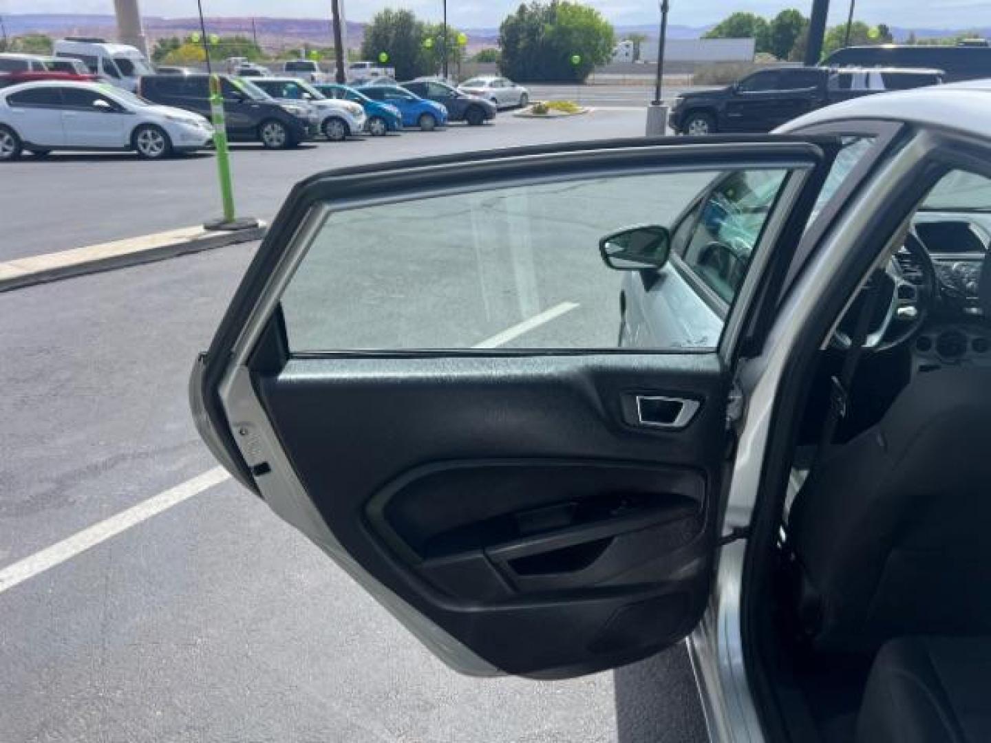 2015 Ingot Silver /Medium Light Stone Ford Fiesta SE (3FADP4EJ4FM) with an EcoBoost 1L I-3 gasoline direct injection engine, Automatic transmission, located at 940 North Main Street, Cedar City, UT, 84720, (435) 628-0023, 37.692936, -113.061897 - Versatile Southern Utah travel starts with this 2015 Ford Fiesta SE hatchback. Its 1.6L 4-cylinder engine, 6-speed automatic transmission, and front-wheel drive make it a smart fit for commuting, errands, and easy city parking. With 102817 miles, this Fiesta is ready for its next adventure. The SE- Photo#20