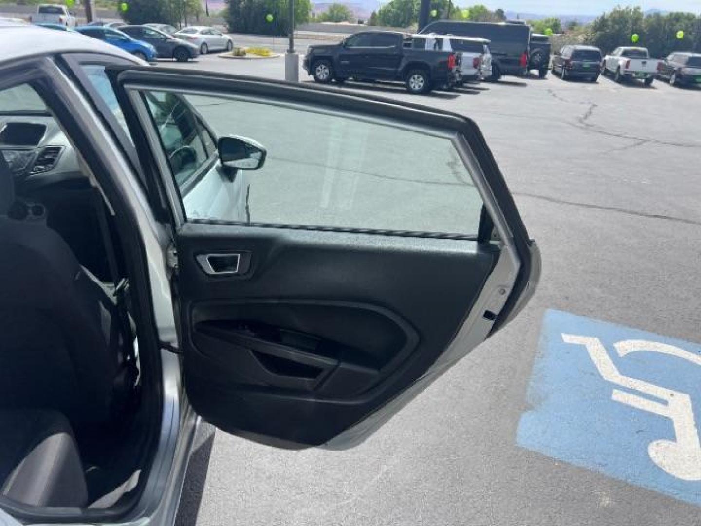 2015 Ingot Silver /Medium Light Stone Ford Fiesta SE (3FADP4EJ4FM) with an EcoBoost 1L I-3 gasoline direct injection engine, Automatic transmission, located at 940 North Main Street, Cedar City, UT, 84720, (435) 628-0023, 37.692936, -113.061897 - Versatile Southern Utah travel starts with this 2015 Ford Fiesta SE hatchback. Its 1.6L 4-cylinder engine, 6-speed automatic transmission, and front-wheel drive make it a smart fit for commuting, errands, and easy city parking. With 102817 miles, this Fiesta is ready for its next adventure. The SE- Photo#24