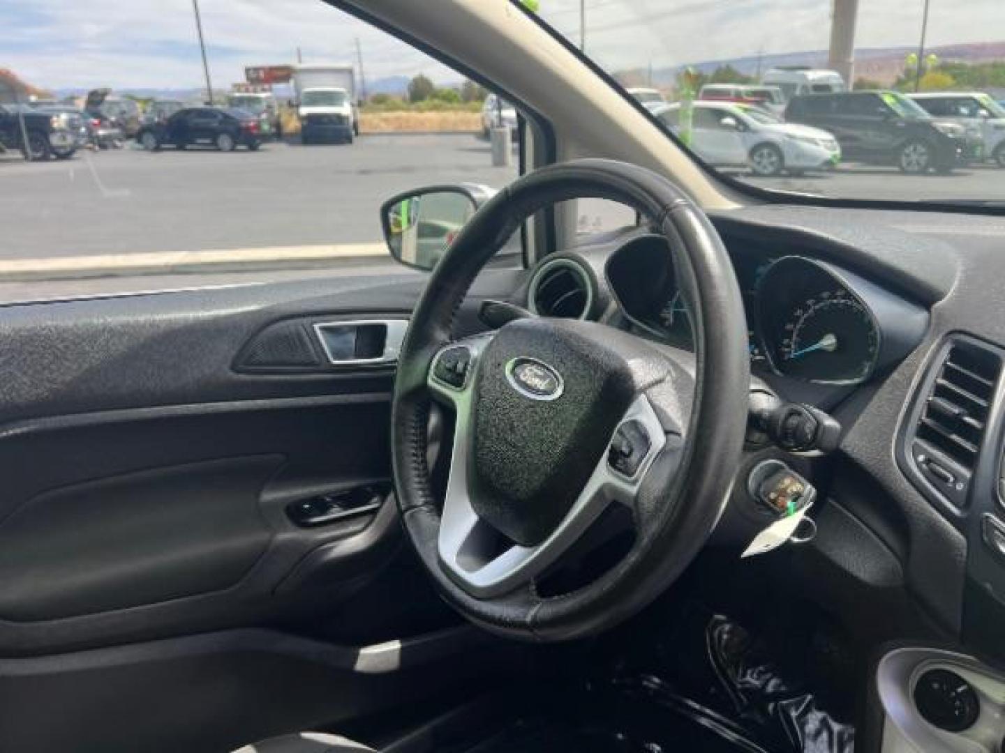2015 Ingot Silver /Medium Light Stone Ford Fiesta SE (3FADP4EJ4FM) with an EcoBoost 1L I-3 gasoline direct injection engine, Automatic transmission, located at 940 North Main Street, Cedar City, UT, 84720, (435) 628-0023, 37.692936, -113.061897 - Versatile Southern Utah travel starts with this 2015 Ford Fiesta SE hatchback. Its 1.6L 4-cylinder engine, 6-speed automatic transmission, and front-wheel drive make it a smart fit for commuting, errands, and easy city parking. With 102817 miles, this Fiesta is ready for its next adventure. The SE- Photo#29