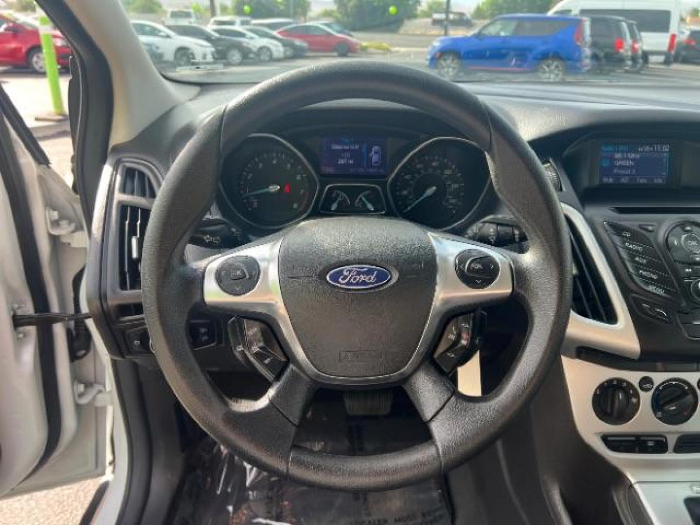2013 Oxford White /Charcoal Black w/Warm Steel Surround Ford Focus SE (1FADP3K20DL) with an 2L I-4 gasoline direct injection engine, Automatic transmission, located at 940 North Main Street, Cedar City, UT, 84720, (435) 628-0023, 37.692936, -113.061897 - We specialize in helping ALL people get the best financing available. No matter your credit score, good, bad or none we can get you an amazing rate. Had a bankruptcy, divorce, or repossessions? We give you the green light to get your credit back on the road. Low down and affordable payments that fit- Photo#15