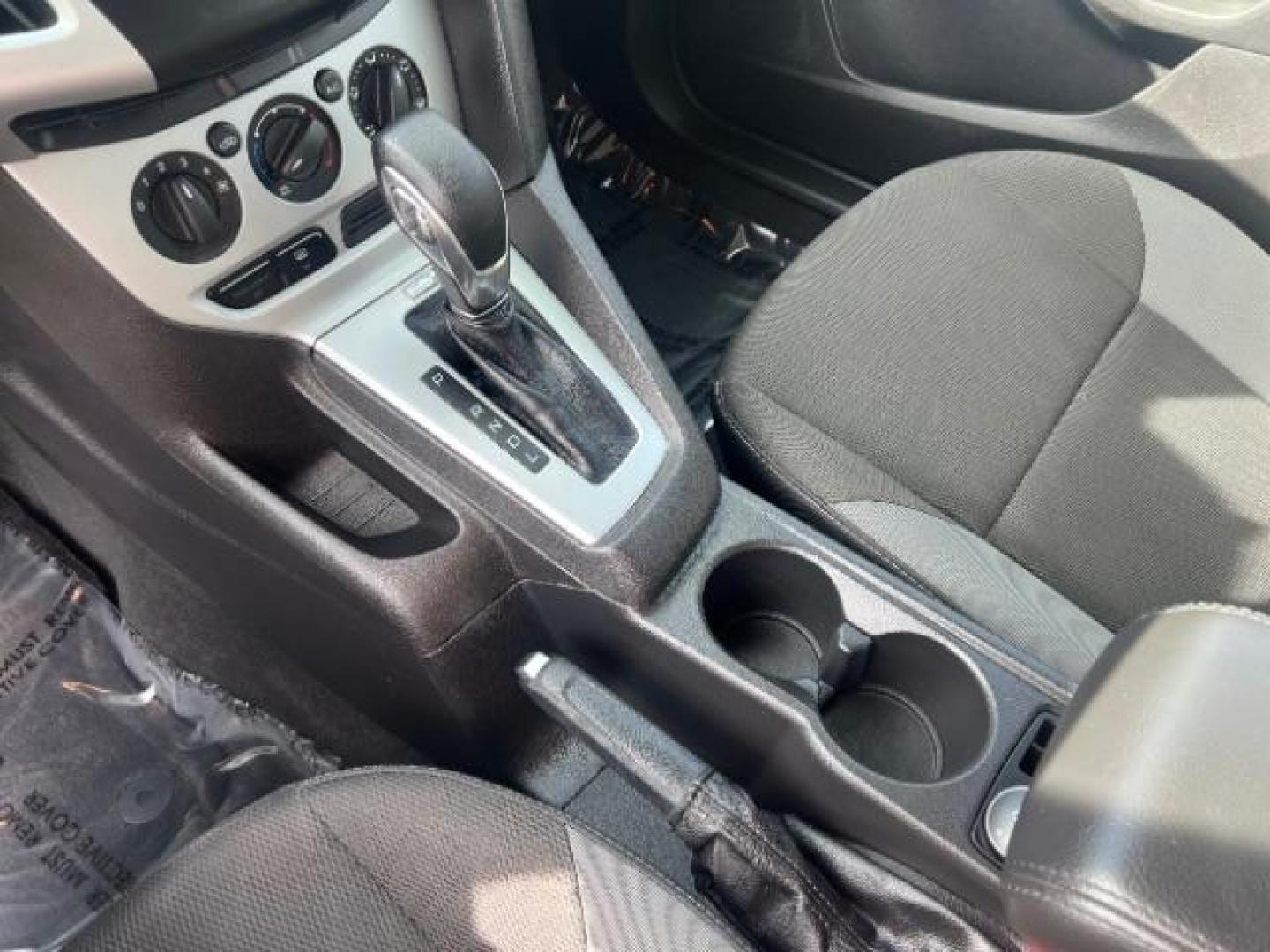 2013 Oxford White /Charcoal Black w/Warm Steel Surround Ford Focus SE (1FADP3K20DL) with an 2L I-4 gasoline direct injection engine, Automatic transmission, located at 940 North Main Street, Cedar City, UT, 84720, (435) 628-0023, 37.692936, -113.061897 - We specialize in helping ALL people get the best financing available. No matter your credit score, good, bad or none we can get you an amazing rate. Had a bankruptcy, divorce, or repossessions? We give you the green light to get your credit back on the road. Low down and affordable payments that fit- Photo#18