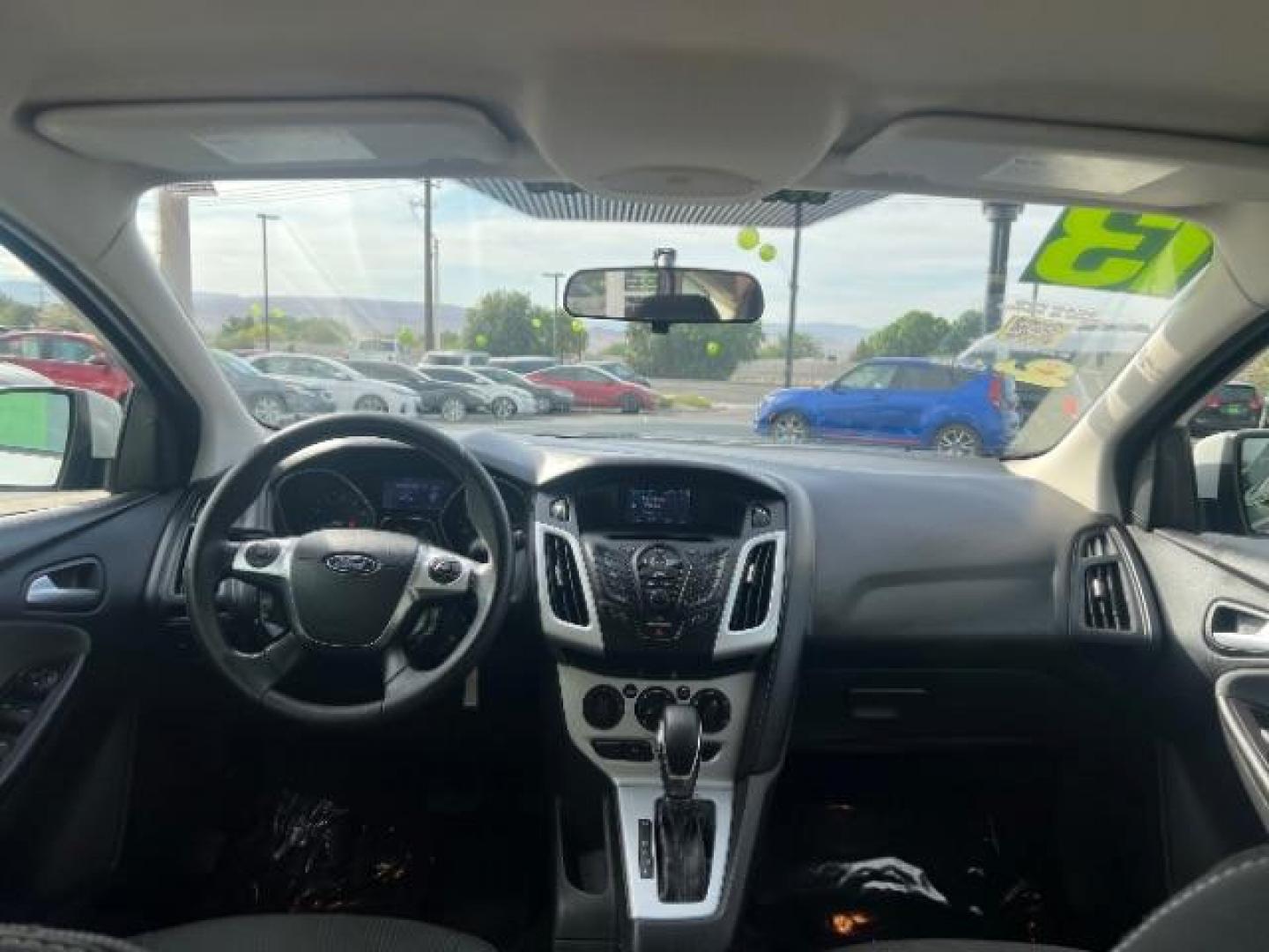 2013 Oxford White /Charcoal Black w/Warm Steel Surround Ford Focus SE (1FADP3K20DL) with an 2L I-4 gasoline direct injection engine, Automatic transmission, located at 940 North Main Street, Cedar City, UT, 84720, (435) 628-0023, 37.692936, -113.061897 - We specialize in helping ALL people get the best financing available. No matter your credit score, good, bad or none we can get you an amazing rate. Had a bankruptcy, divorce, or repossessions? We give you the green light to get your credit back on the road. Low down and affordable payments that fit- Photo#22