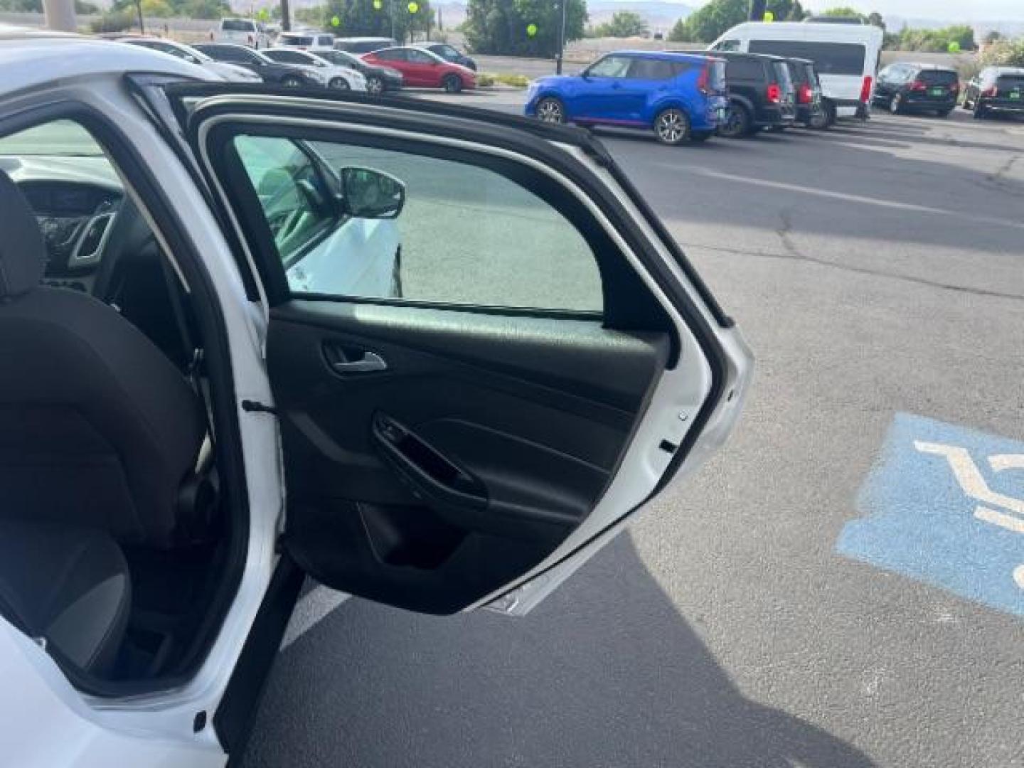 2013 Oxford White /Charcoal Black w/Warm Steel Surround Ford Focus SE (1FADP3K20DL) with an 2L I-4 gasoline direct injection engine, Automatic transmission, located at 940 North Main Street, Cedar City, UT, 84720, (435) 628-0023, 37.692936, -113.061897 - We specialize in helping ALL people get the best financing available. No matter your credit score, good, bad or none we can get you an amazing rate. Had a bankruptcy, divorce, or repossessions? We give you the green light to get your credit back on the road. Low down and affordable payments that fit- Photo#24