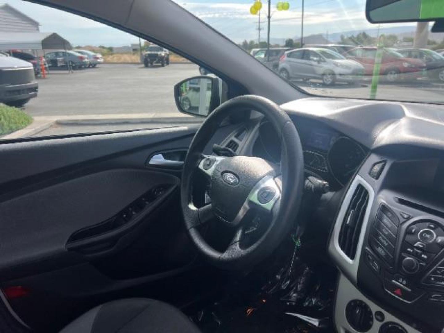 2013 Oxford White /Charcoal Black w/Warm Steel Surround Ford Focus SE (1FADP3K20DL) with an 2L I-4 gasoline direct injection engine, Automatic transmission, located at 940 North Main Street, Cedar City, UT, 84720, (435) 628-0023, 37.692936, -113.061897 - We specialize in helping ALL people get the best financing available. No matter your credit score, good, bad or none we can get you an amazing rate. Had a bankruptcy, divorce, or repossessions? We give you the green light to get your credit back on the road. Low down and affordable payments that fit- Photo#29