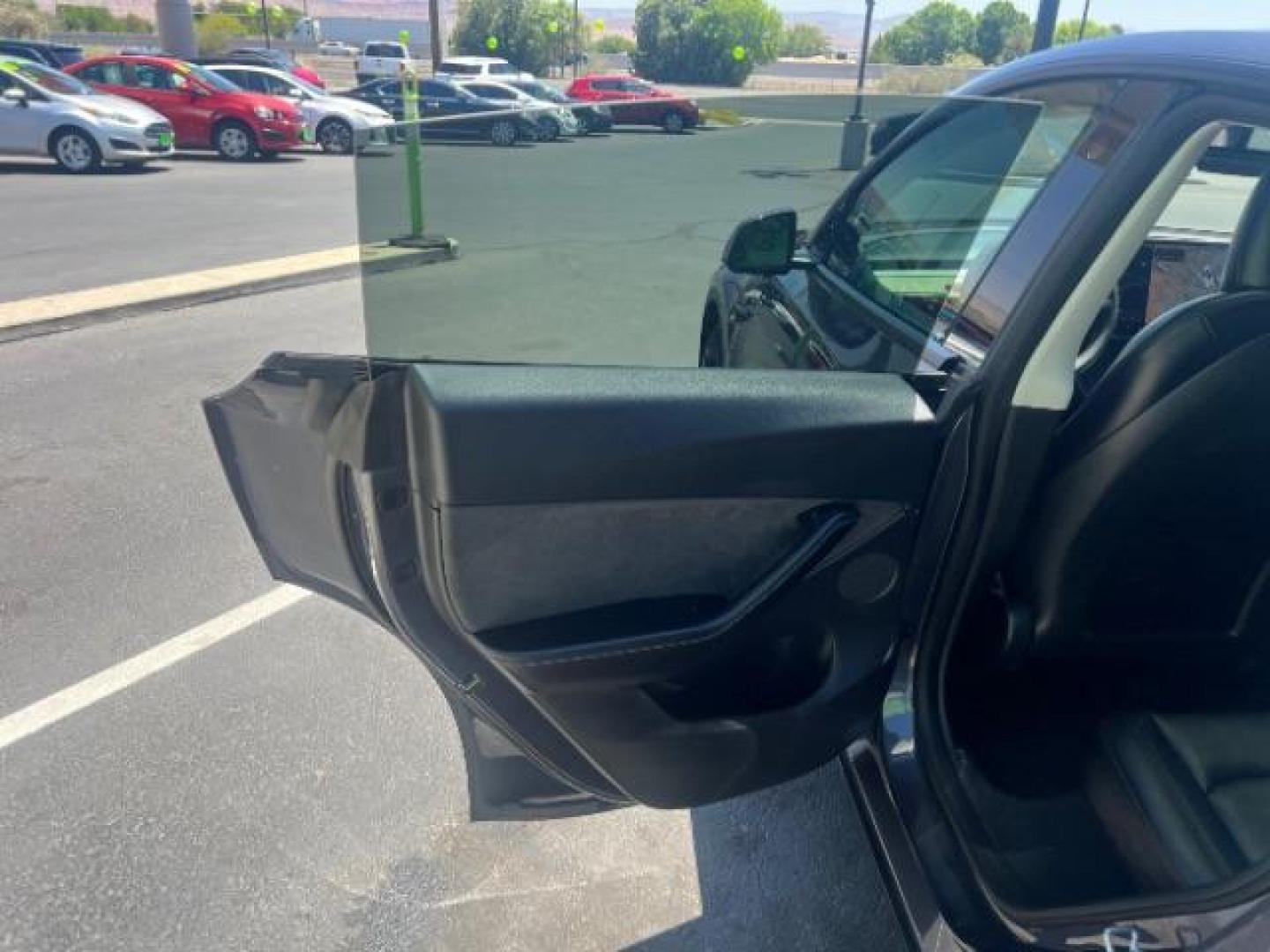 2021 Midnight Silver Metallic /Black Tesla Model Y Long Range Dual Motor All-Wheel Drive (5YJYGDEE4MF) with an ELECTRIC engine, Electric transmission, located at 1865 East Red Hills Pkwy, St. George, 84770, (435) 628-0023, 37.120850, -113.543640 - Excellent Tesla Model Y Long Range All Wheel Drive. HW3. Inside and outside in great shape. Tires are good. All our Teslas come with charging kit. Battery is healthy. Gets 285 on full charge. Recurrent Battery Health Report 95% 1 Owner, Clean title, no accidents Still has remaining 120k mile T- Photo#20
