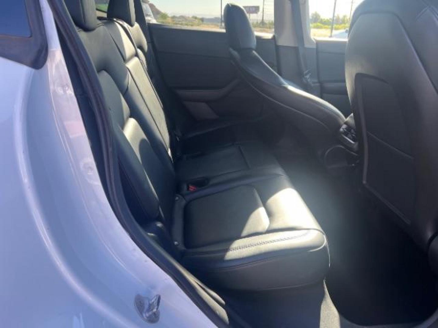 2022 Pearl White Multi-Coat /Black Tesla Model Y Long Range Dual Motor All-Wheel Drive (7SAYGDEE5NF) with an ELECTRIC engine, Electric transmission, located at 1865 East Red Hills Pkwy, St. George, 84770, (435) 628-0023, 37.120850, -113.543640 - Excellent Tesla Model Y Long Range All Wheel Drive. HW3. In great condition for the miles. Most affordable model Y you'll find. Act now! All our Teslas come with mobile charging kit. Battery is healthy. Gets 265 on full charge. Clean title, 1 Owner Recurrent Battery Report 95% Still has remaini- Photo#26