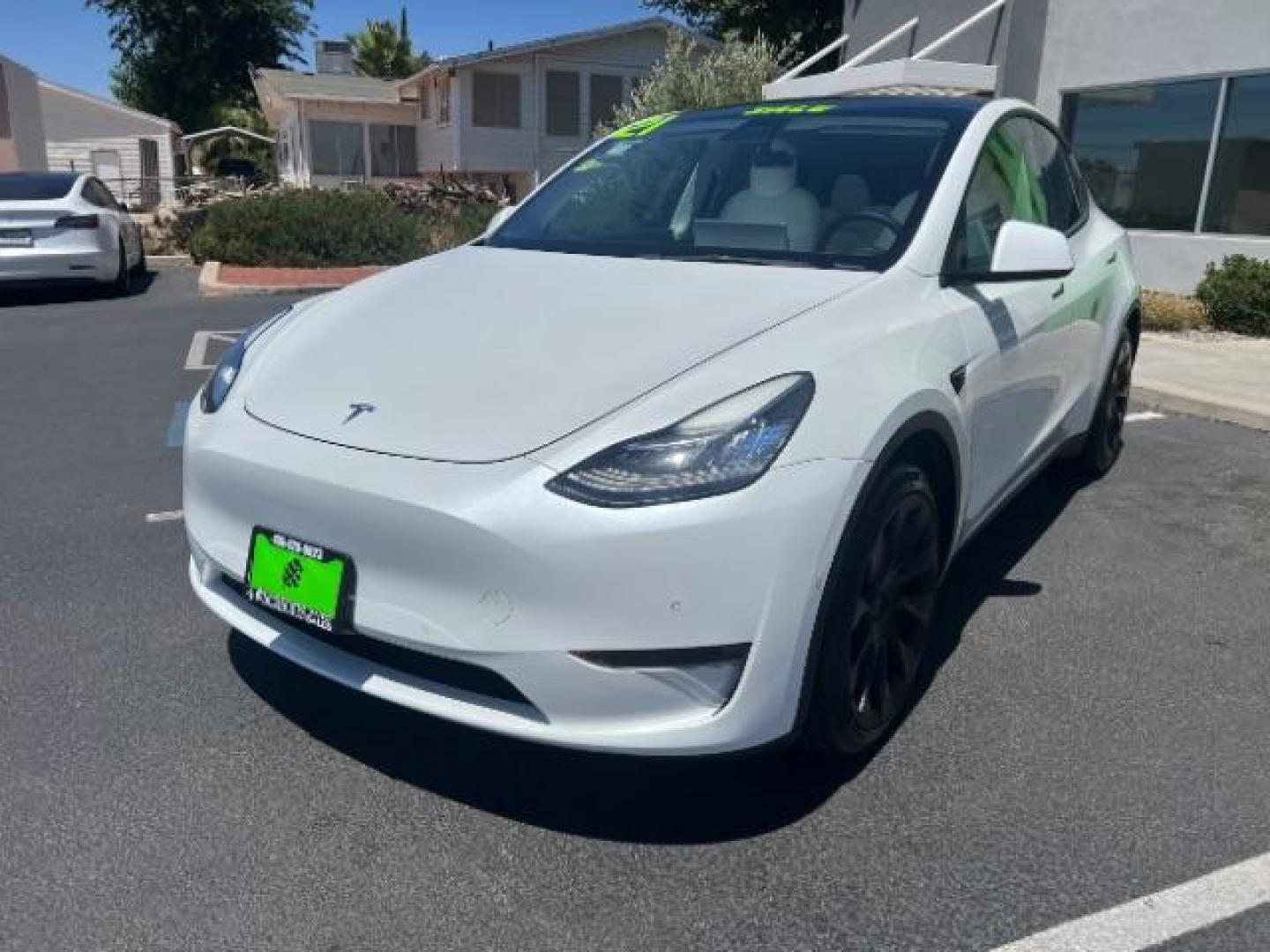 2021 Pearl White Multi-Coat /White/Black Tesla Model Y Long Range Dual Motor All-Wheel Drive (5YJYGDEE7MF) with an ELECTRIC engine, Electric transmission, located at 1865 East Red Hills Pkwy, St. George, 84770, (435) 628-0023, 37.120850, -113.543640 - Excellent Tesla Model Y Long Range All Wheel Drive. HW3, Interior and exterior in great condition. Small scratches and dings as pictured. Every Tesla we sell has had cabin air filter replaced, radiator cleaned, fluids topped AND comes with a mobile charging kit! Battery is healthy and gets 270 on- Photo#2