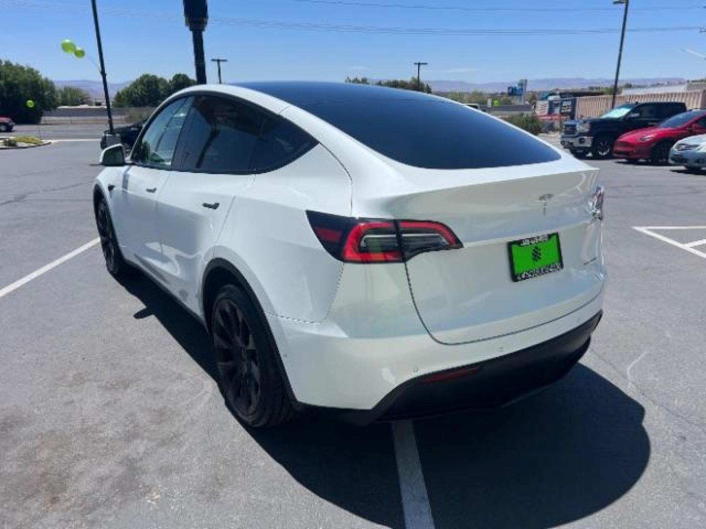 2021 Pearl White Multi-Coat /White/Black Tesla Model Y Long Range Dual Motor All-Wheel Drive (5YJYGDEE7MF) with an ELECTRIC engine, Electric transmission, located at 1865 East Red Hills Pkwy, St. George, 84770, (435) 628-0023, 37.120850, -113.543640 - Excellent Tesla Model Y Long Range All Wheel Drive. HW3, Interior and exterior in great condition. Small scratches and dings as pictured. Every Tesla we sell has had cabin air filter replaced, radiator cleaned, fluids topped AND comes with a mobile charging kit! Battery is healthy and gets 270 on- Photo#4