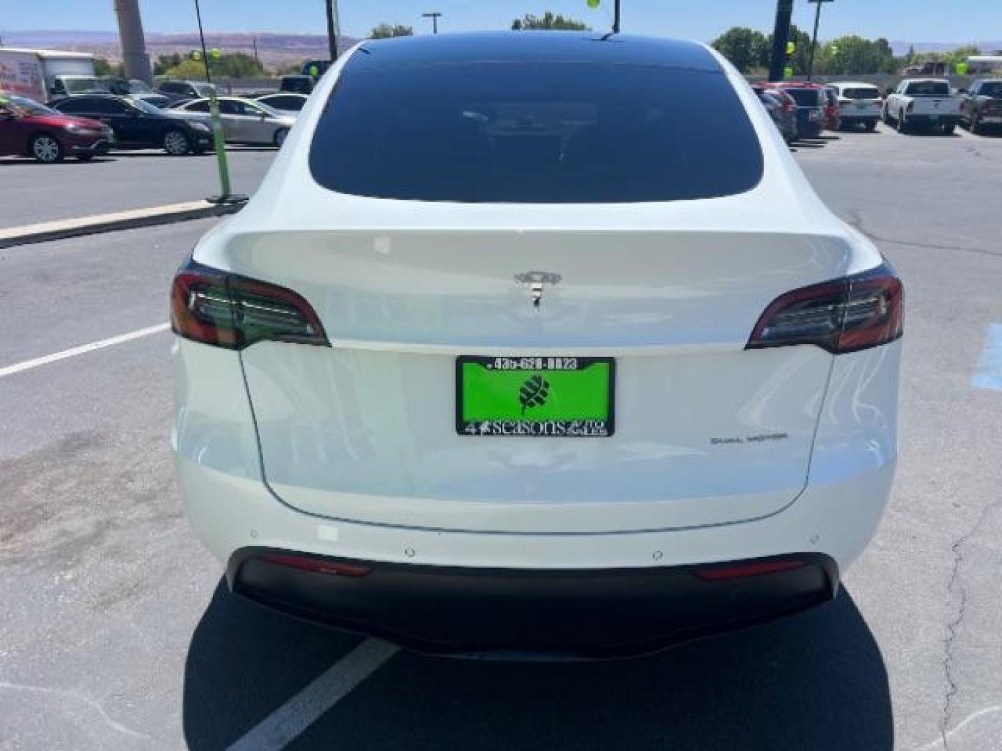 2021 Pearl White Multi-Coat /White/Black Tesla Model Y Long Range Dual Motor All-Wheel Drive (5YJYGDEE7MF) with an ELECTRIC engine, Electric transmission, located at 1865 East Red Hills Pkwy, St. George, 84770, (435) 628-0023, 37.120850, -113.543640 - Excellent Tesla Model Y Long Range All Wheel Drive. HW3, Interior and exterior in great condition. Small scratches and dings as pictured. Every Tesla we sell has had cabin air filter replaced, radiator cleaned, fluids topped AND comes with a mobile charging kit! Battery is healthy and gets 270 on- Photo#5