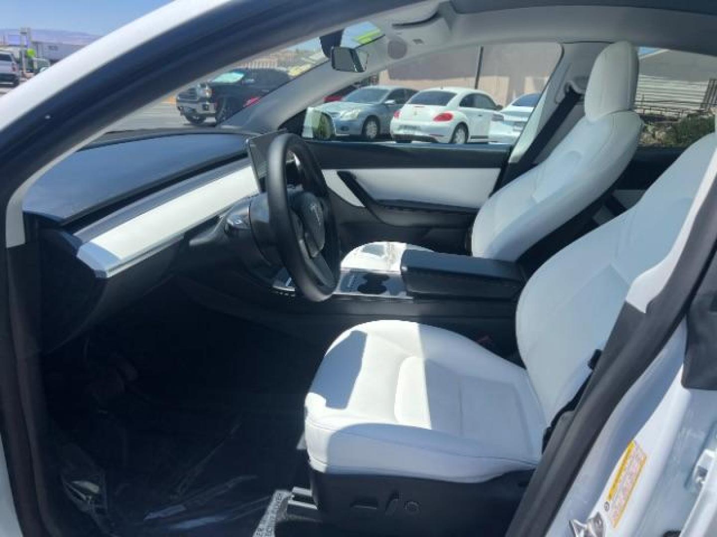 2021 Pearl White Multi-Coat /White/Black Tesla Model Y Long Range Dual Motor All-Wheel Drive (5YJYGDEE7MF) with an ELECTRIC engine, Electric transmission, located at 1865 East Red Hills Pkwy, St. George, 84770, (435) 628-0023, 37.120850, -113.543640 - Excellent Tesla Model Y Long Range All Wheel Drive. HW3, Interior and exterior in great condition. Small scratches and dings as pictured. Every Tesla we sell has had cabin air filter replaced, radiator cleaned, fluids topped AND comes with a mobile charging kit! Battery is healthy and gets 270 on- Photo#14