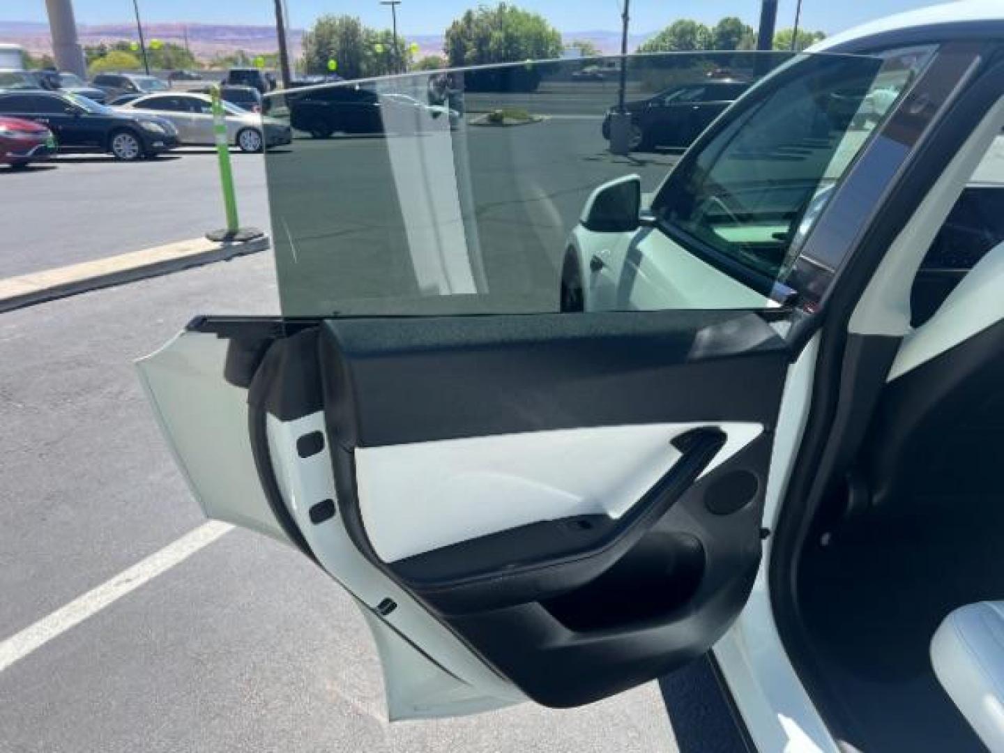 2021 Pearl White Multi-Coat /White/Black Tesla Model Y Long Range Dual Motor All-Wheel Drive (5YJYGDEE7MF) with an ELECTRIC engine, Electric transmission, located at 1865 East Red Hills Pkwy, St. George, 84770, (435) 628-0023, 37.120850, -113.543640 - Excellent Tesla Model Y Long Range All Wheel Drive. HW3, Interior and exterior in great condition. Small scratches and dings as pictured. Every Tesla we sell has had cabin air filter replaced, radiator cleaned, fluids topped AND comes with a mobile charging kit! Battery is healthy and gets 270 on- Photo#18