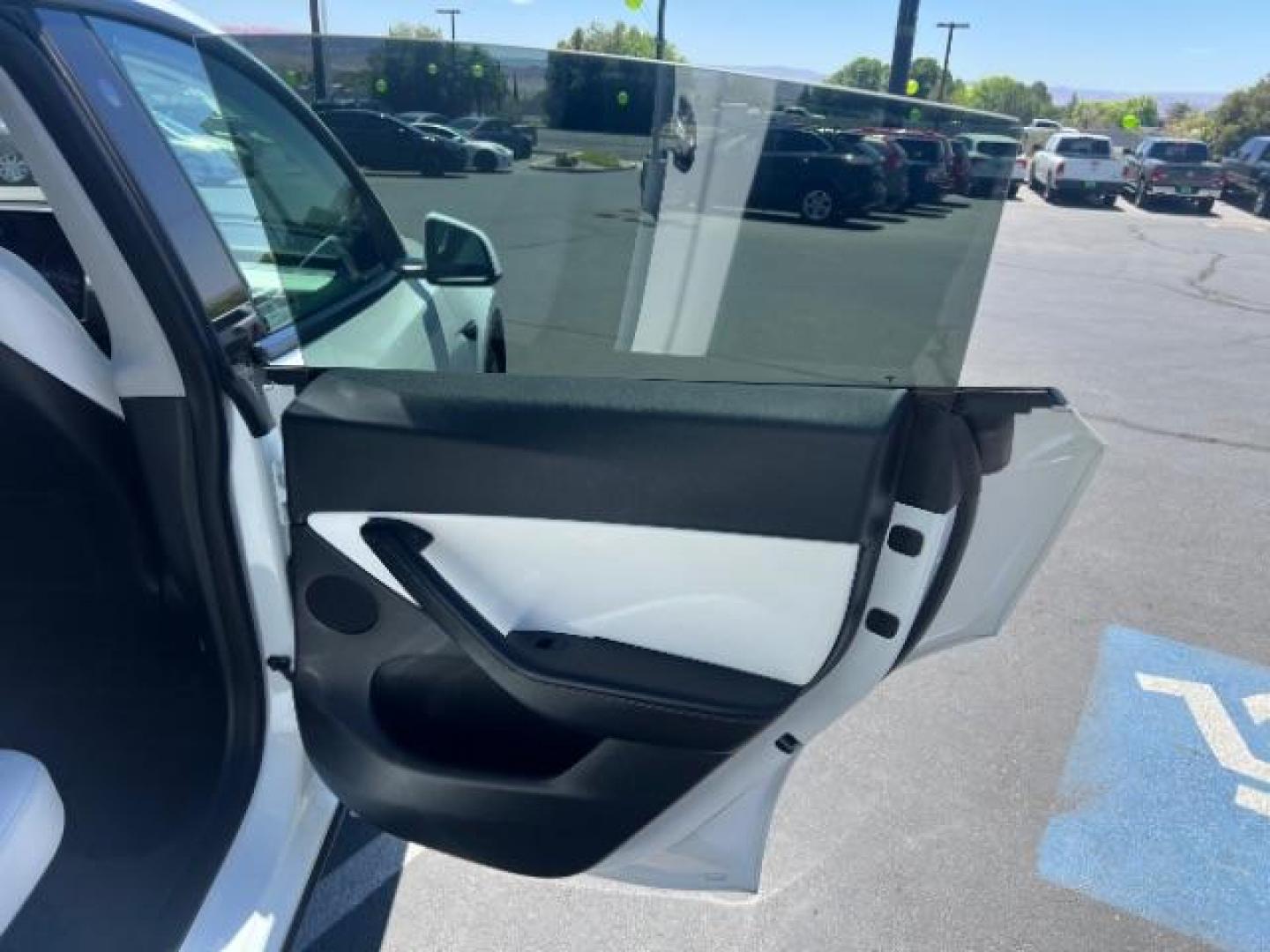 2021 Pearl White Multi-Coat /White/Black Tesla Model Y Long Range Dual Motor All-Wheel Drive (5YJYGDEE7MF) with an ELECTRIC engine, Electric transmission, located at 1865 East Red Hills Pkwy, St. George, 84770, (435) 628-0023, 37.120850, -113.543640 - Excellent Tesla Model Y Long Range All Wheel Drive. HW3, Interior and exterior in great condition. Small scratches and dings as pictured. Every Tesla we sell has had cabin air filter replaced, radiator cleaned, fluids topped AND comes with a mobile charging kit! Battery is healthy and gets 270 on- Photo#23