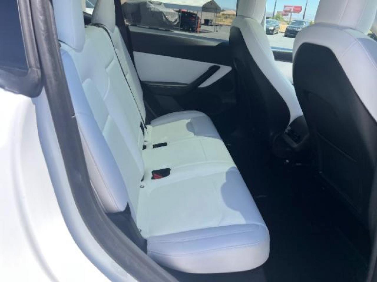 2021 Pearl White Multi-Coat /White/Black Tesla Model Y Long Range Dual Motor All-Wheel Drive (5YJYGDEE7MF) with an ELECTRIC engine, Electric transmission, located at 1865 East Red Hills Pkwy, St. George, 84770, (435) 628-0023, 37.120850, -113.543640 - Excellent Tesla Model Y Long Range All Wheel Drive. HW3, Interior and exterior in great condition. Small scratches and dings as pictured. Every Tesla we sell has had cabin air filter replaced, radiator cleaned, fluids topped AND comes with a mobile charging kit! Battery is healthy and gets 270 on- Photo#24