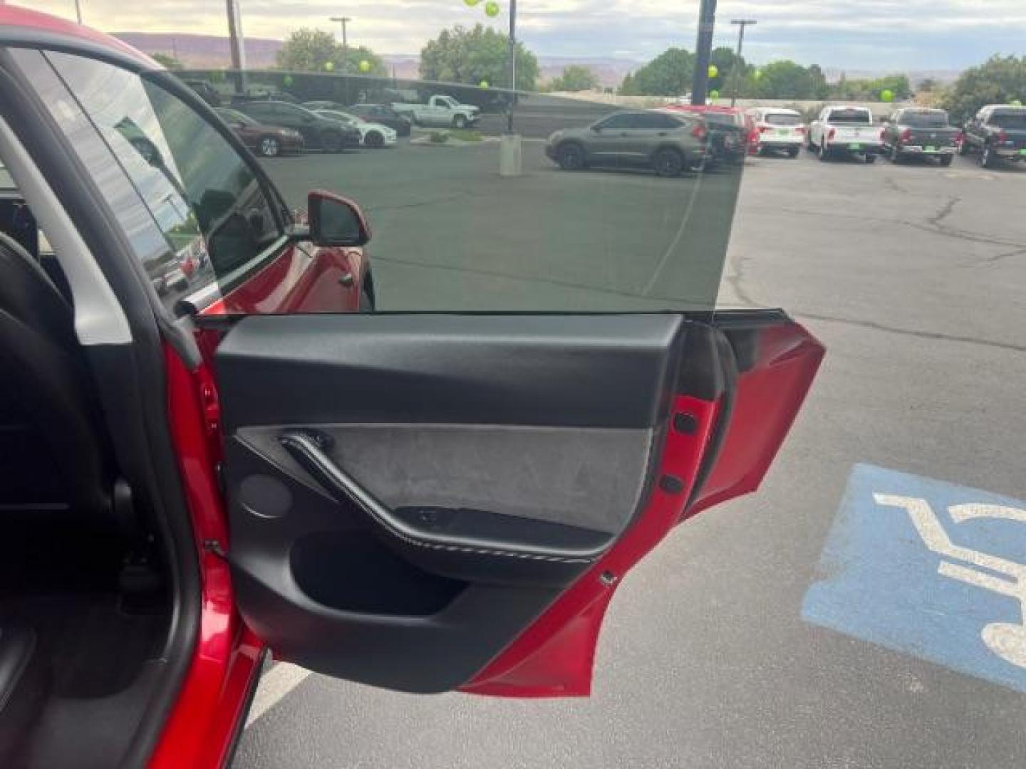 2022 Red Multi-Coat /Black Tesla Model Y Long Range Dual Motor All-Wheel Drive (7SAYGDEE8NF) with an ELECTRIC engine, Electric transmission, located at 1865 East Red Hills Pkwy, St. George, 84770, (435) 628-0023, 37.120850, -113.543640 - Excellent Tesla Model Y Long Range All Wheel Drive. HW3, Interior and exterior in great condition. Small scratches and dings as pictured. Every Tesla we sell has had cabin air filter replaced, radiator cleaned, fluids topped AND comes with a mobile charging kit! Battery is healthy and gets 270 on- Photo#25