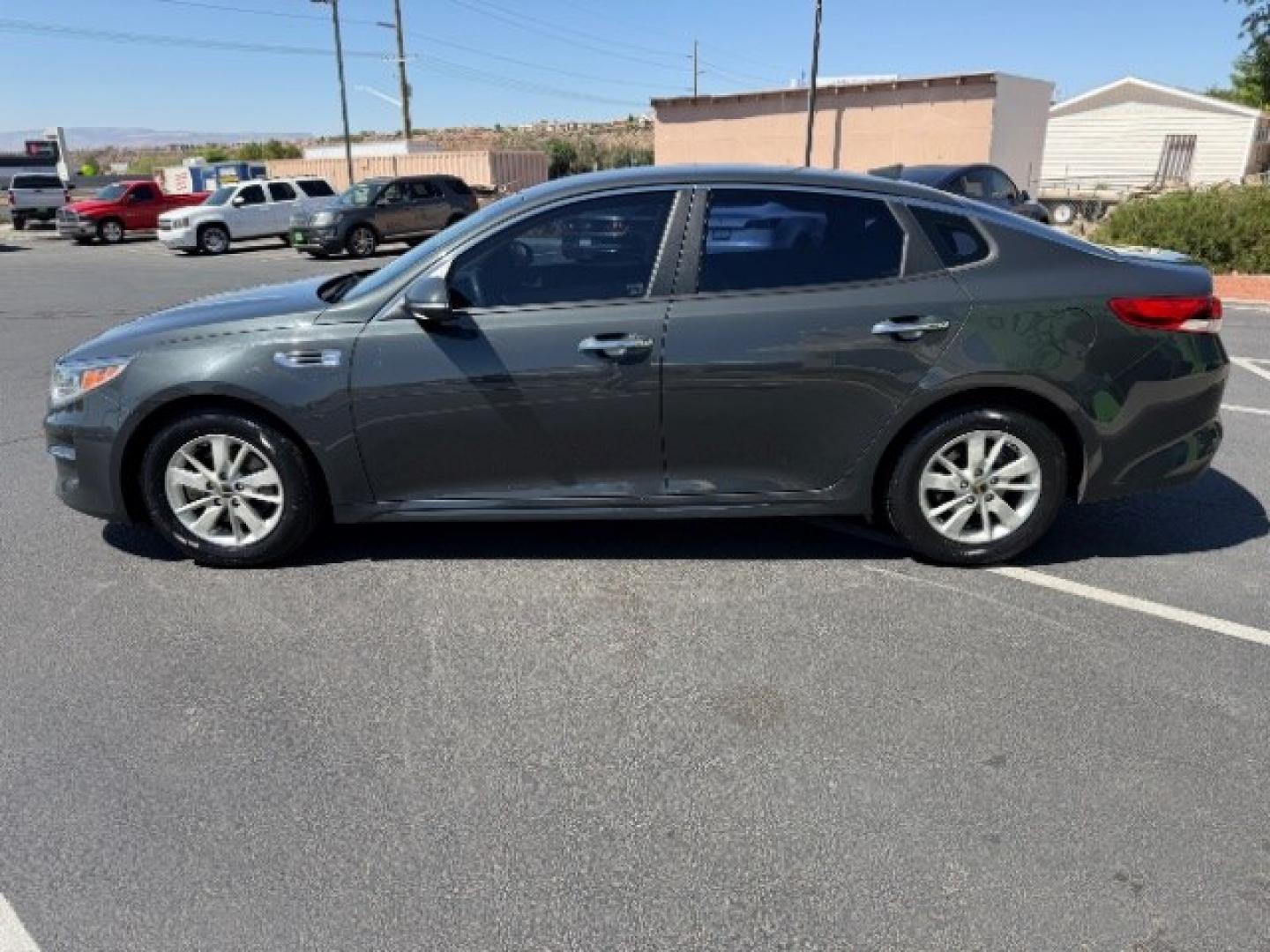 2016 Titanium Gray /Beige Kia Optima LX (5XXGT4L3XGG) with an Theta II 2.4L I-4 gasoline direct injection engine, Automatic transmission, located at 940 North Main Street, Cedar City, UT, 84720, (435) 628-0023, 37.692936, -113.061897 - We specialize in helping ALL people get the best financing available. No matter your credit score, good, bad or none we can get you an amazing rate. Had a bankruptcy, divorce, or repossessions? We give you the green light to get your credit back on the road. Low down and affordable payments that fit- Photo#3
