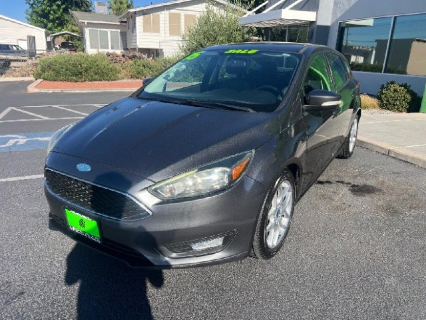 2015 Magnetic /Charcoal Black Ford Focus SE (1FADP3K25FL) with an 2L I-4 gasoline direct injection engine, Automatic transmission, located at 940 North Main Street, Cedar City, UT, 84720, (435) 628-0023, 37.692936, -113.061897 - We specialize in helping ALL people get the best financing available. No matter your credit score, good, bad or none we can get you an amazing rate. Had a bankruptcy, divorce, or repossessions? We give you the green light to get your credit back on the road. Low down and affordable payments that fit- Photo#2