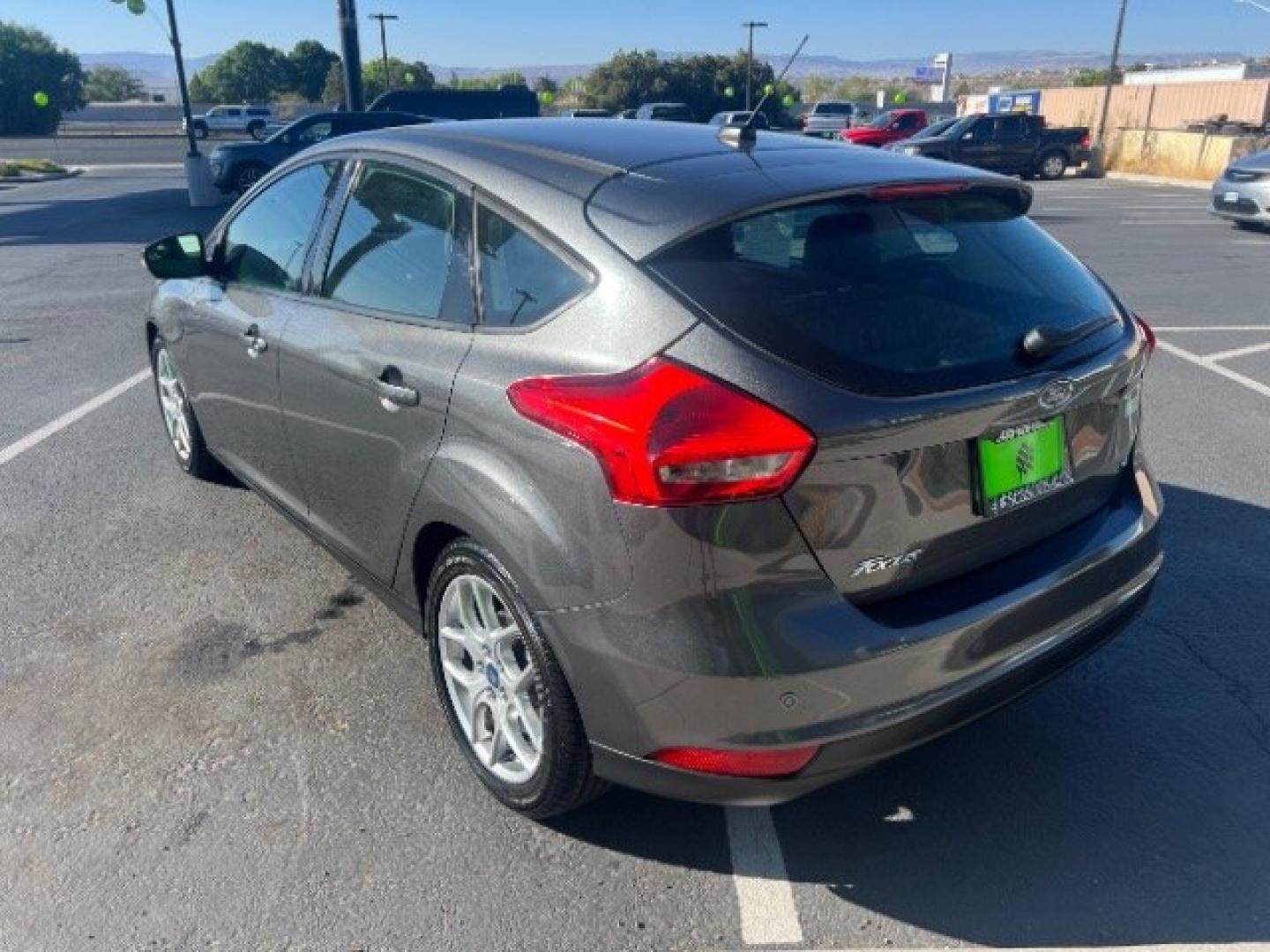 2015 Magnetic /Charcoal Black Ford Focus SE (1FADP3K25FL) with an 2L I-4 gasoline direct injection engine, Automatic transmission, located at 940 North Main Street, Cedar City, UT, 84720, (435) 628-0023, 37.692936, -113.061897 - We specialize in helping ALL people get the best financing available. No matter your credit score, good, bad or none we can get you an amazing rate. Had a bankruptcy, divorce, or repossessions? We give you the green light to get your credit back on the road. Low down and affordable payments that fit- Photo#4