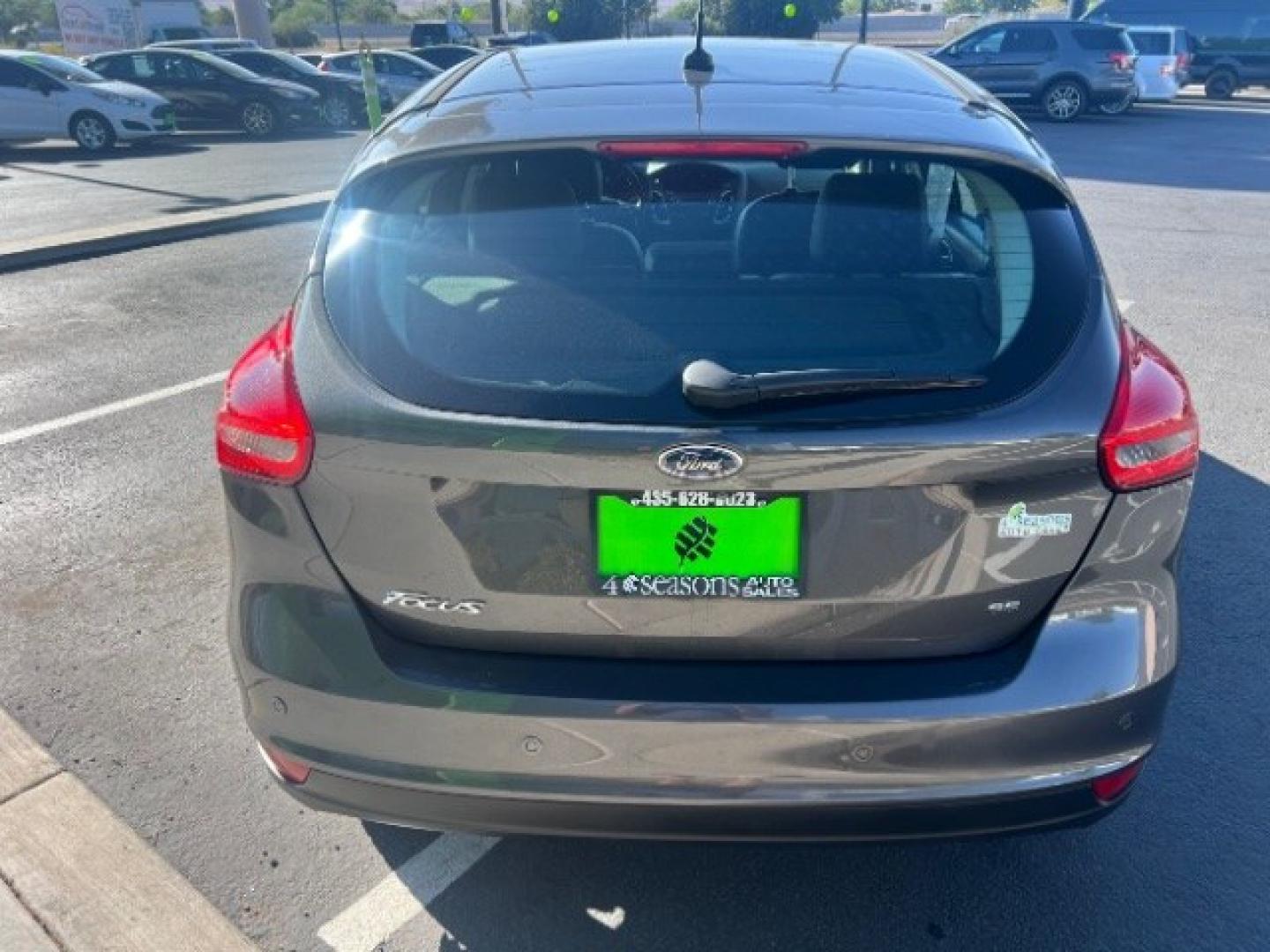 2015 Magnetic /Charcoal Black Ford Focus SE (1FADP3K25FL) with an 2L I-4 gasoline direct injection engine, Automatic transmission, located at 940 North Main Street, Cedar City, UT, 84720, (435) 628-0023, 37.692936, -113.061897 - We specialize in helping ALL people get the best financing available. No matter your credit score, good, bad or none we can get you an amazing rate. Had a bankruptcy, divorce, or repossessions? We give you the green light to get your credit back on the road. Low down and affordable payments that fit- Photo#5