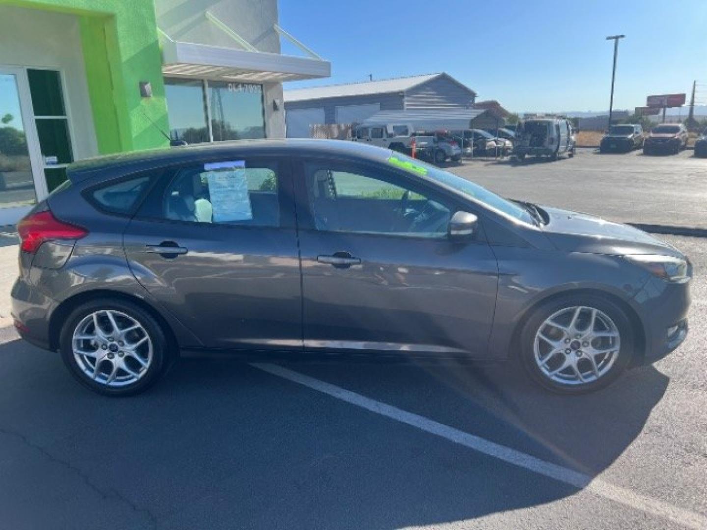 2015 Magnetic /Charcoal Black Ford Focus SE (1FADP3K25FL) with an 2L I-4 gasoline direct injection engine, Automatic transmission, located at 940 North Main Street, Cedar City, UT, 84720, (435) 628-0023, 37.692936, -113.061897 - We specialize in helping ALL people get the best financing available. No matter your credit score, good, bad or none we can get you an amazing rate. Had a bankruptcy, divorce, or repossessions? We give you the green light to get your credit back on the road. Low down and affordable payments that fit- Photo#7