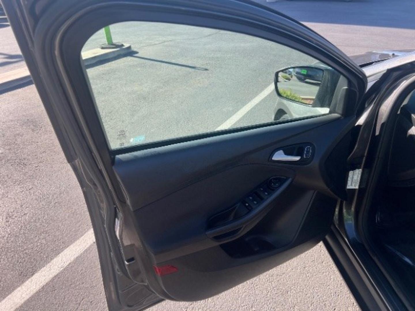 2015 Magnetic /Charcoal Black Ford Focus SE (1FADP3K25FL) with an 2L I-4 gasoline direct injection engine, Automatic transmission, located at 940 North Main Street, Cedar City, UT, 84720, (435) 628-0023, 37.692936, -113.061897 - We specialize in helping ALL people get the best financing available. No matter your credit score, good, bad or none we can get you an amazing rate. Had a bankruptcy, divorce, or repossessions? We give you the green light to get your credit back on the road. Low down and affordable payments that fit- Photo#12