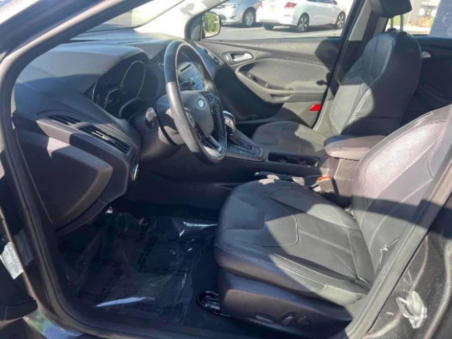 2015 Magnetic /Charcoal Black Ford Focus SE (1FADP3K25FL) with an 2L I-4 gasoline direct injection engine, Automatic transmission, located at 940 North Main Street, Cedar City, UT, 84720, (435) 628-0023, 37.692936, -113.061897 - We specialize in helping ALL people get the best financing available. No matter your credit score, good, bad or none we can get you an amazing rate. Had a bankruptcy, divorce, or repossessions? We give you the green light to get your credit back on the road. Low down and affordable payments that fit- Photo#14