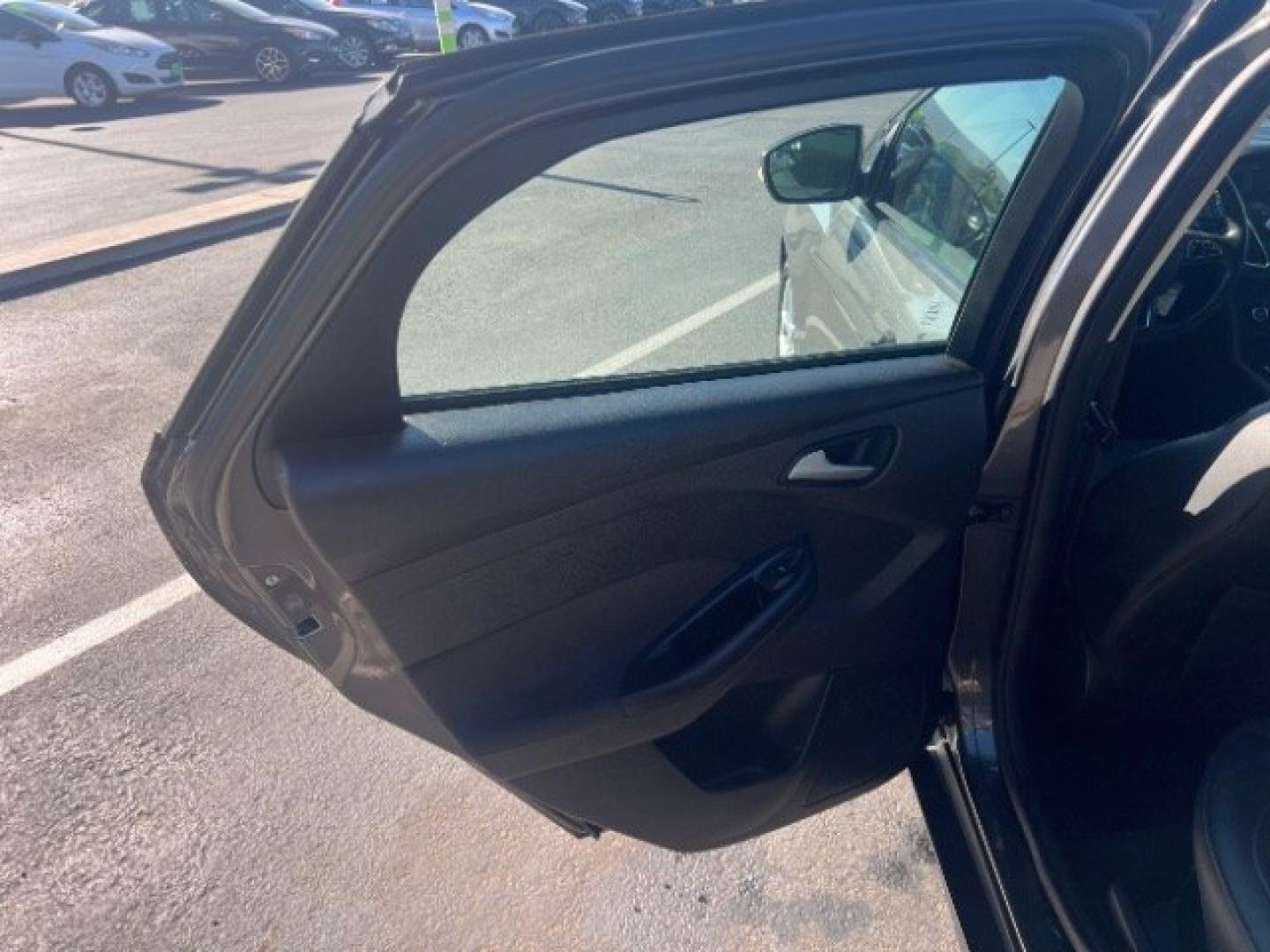 2015 Magnetic /Charcoal Black Ford Focus SE (1FADP3K25FL) with an 2L I-4 gasoline direct injection engine, Automatic transmission, located at 940 North Main Street, Cedar City, UT, 84720, (435) 628-0023, 37.692936, -113.061897 - We specialize in helping ALL people get the best financing available. No matter your credit score, good, bad or none we can get you an amazing rate. Had a bankruptcy, divorce, or repossessions? We give you the green light to get your credit back on the road. Low down and affordable payments that fit- Photo#19