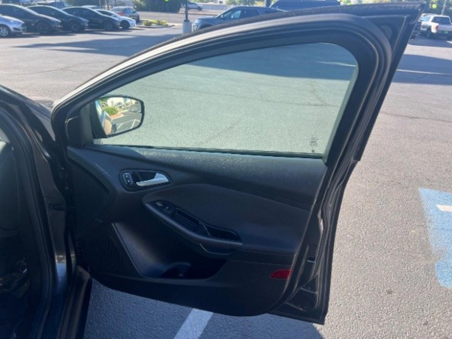2015 Magnetic /Charcoal Black Ford Focus SE (1FADP3K25FL) with an 2L I-4 gasoline direct injection engine, Automatic transmission, located at 940 North Main Street, Cedar City, UT, 84720, (435) 628-0023, 37.692936, -113.061897 - We specialize in helping ALL people get the best financing available. No matter your credit score, good, bad or none we can get you an amazing rate. Had a bankruptcy, divorce, or repossessions? We give you the green light to get your credit back on the road. Low down and affordable payments that fit- Photo#26