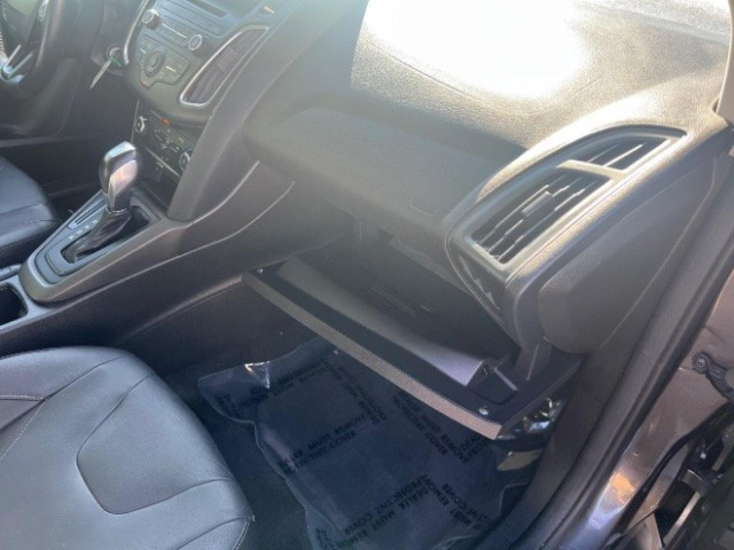 2015 Magnetic /Charcoal Black Ford Focus SE (1FADP3K25FL) with an 2L I-4 gasoline direct injection engine, Automatic transmission, located at 940 North Main Street, Cedar City, UT, 84720, (435) 628-0023, 37.692936, -113.061897 - We specialize in helping ALL people get the best financing available. No matter your credit score, good, bad or none we can get you an amazing rate. Had a bankruptcy, divorce, or repossessions? We give you the green light to get your credit back on the road. Low down and affordable payments that fit- Photo#28