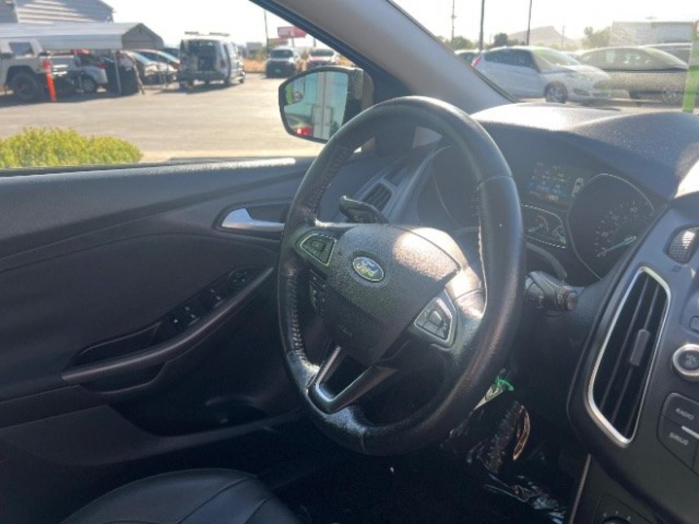 2015 Magnetic /Charcoal Black Ford Focus SE (1FADP3K25FL) with an 2L I-4 gasoline direct injection engine, Automatic transmission, located at 940 North Main Street, Cedar City, UT, 84720, (435) 628-0023, 37.692936, -113.061897 - We specialize in helping ALL people get the best financing available. No matter your credit score, good, bad or none we can get you an amazing rate. Had a bankruptcy, divorce, or repossessions? We give you the green light to get your credit back on the road. Low down and affordable payments that fit- Photo#29