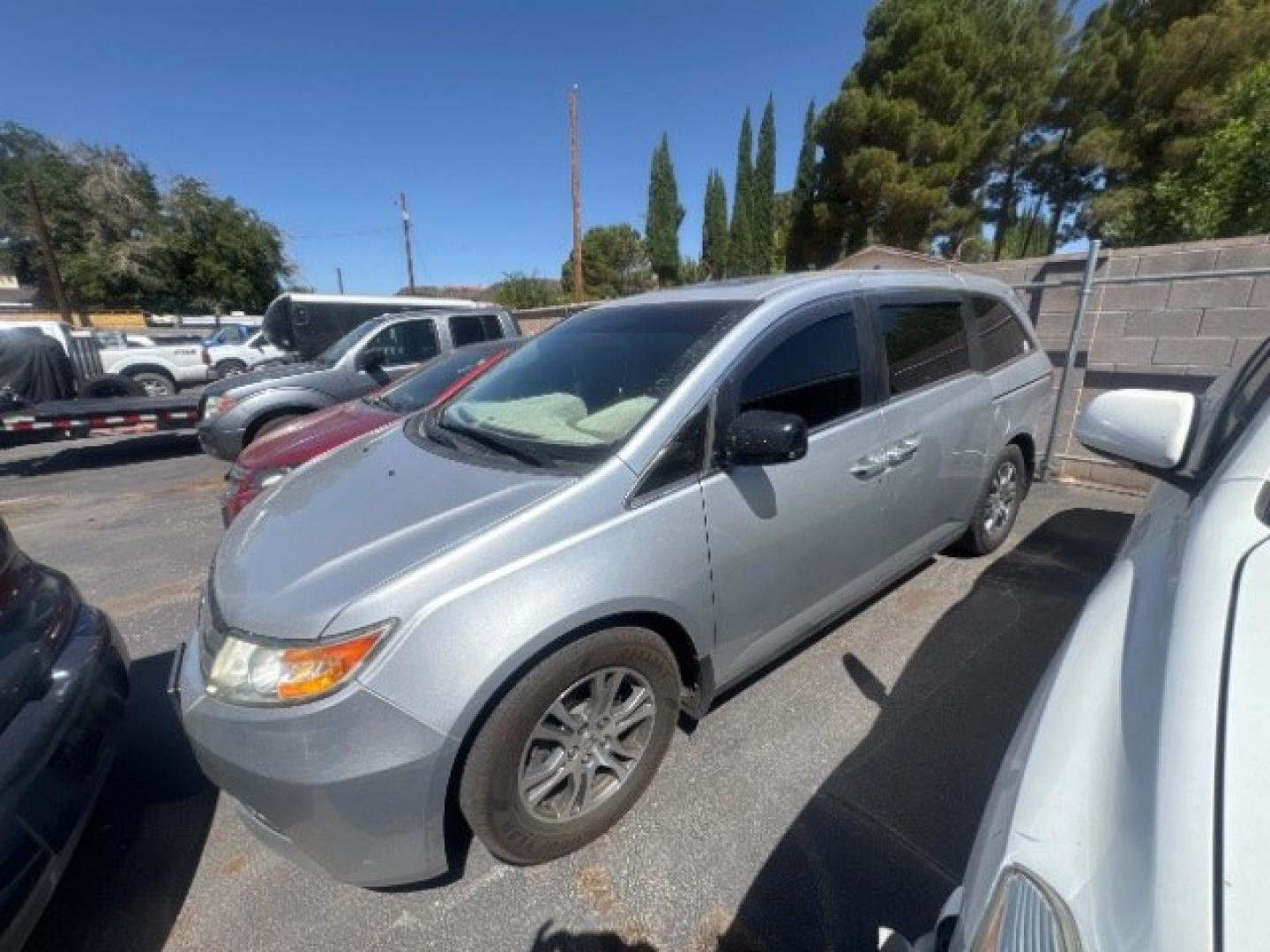 2012 Alabaster Silver Metallic /Gray Honda Odyssey EX-L (5FNRL5H6XCB) with an 3.5L V-6 i-VTEC variable valve control engine, Automatic transmission, located at 1865 East Red Hills Pkwy, St. George, 84770, (435) 628-0023, 37.120850, -113.543640 - This vehicle is a Mechanic Special. This means it will need some love. Runs a drives fine but has body damage, leaks or other mechanical issues. It did NOT pass our 50 point inspection. Get a great deal on a less than perfect car. These cars do NOT qualify for our in house financing. Cash and carry,- Photo#1