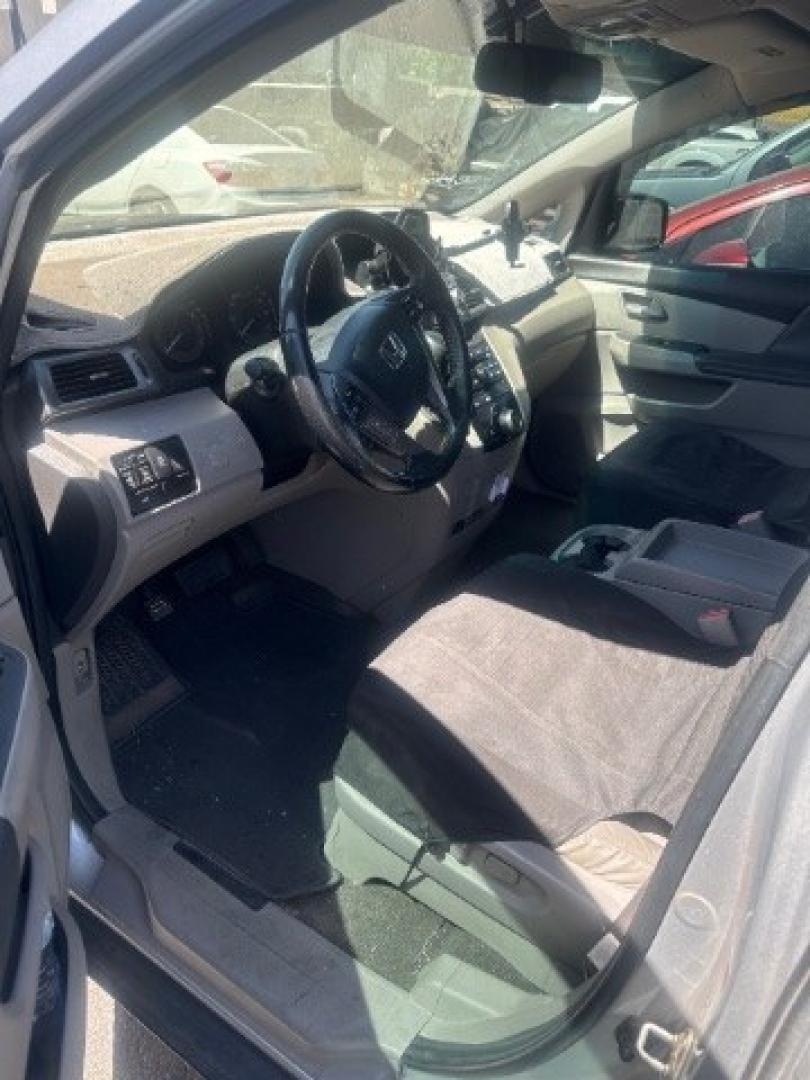 2012 Alabaster Silver Metallic /Gray Honda Odyssey EX-L (5FNRL5H6XCB) with an 3.5L V-6 i-VTEC variable valve control engine, Automatic transmission, located at 1865 East Red Hills Pkwy, St. George, 84770, (435) 628-0023, 37.120850, -113.543640 - This vehicle is a Mechanic Special. This means it will need some love. Runs a drives fine but has body damage, leaks or other mechanical issues. It did NOT pass our 50 point inspection. Get a great deal on a less than perfect car. These cars do NOT qualify for our in house financing. Cash and carry,- Photo#2