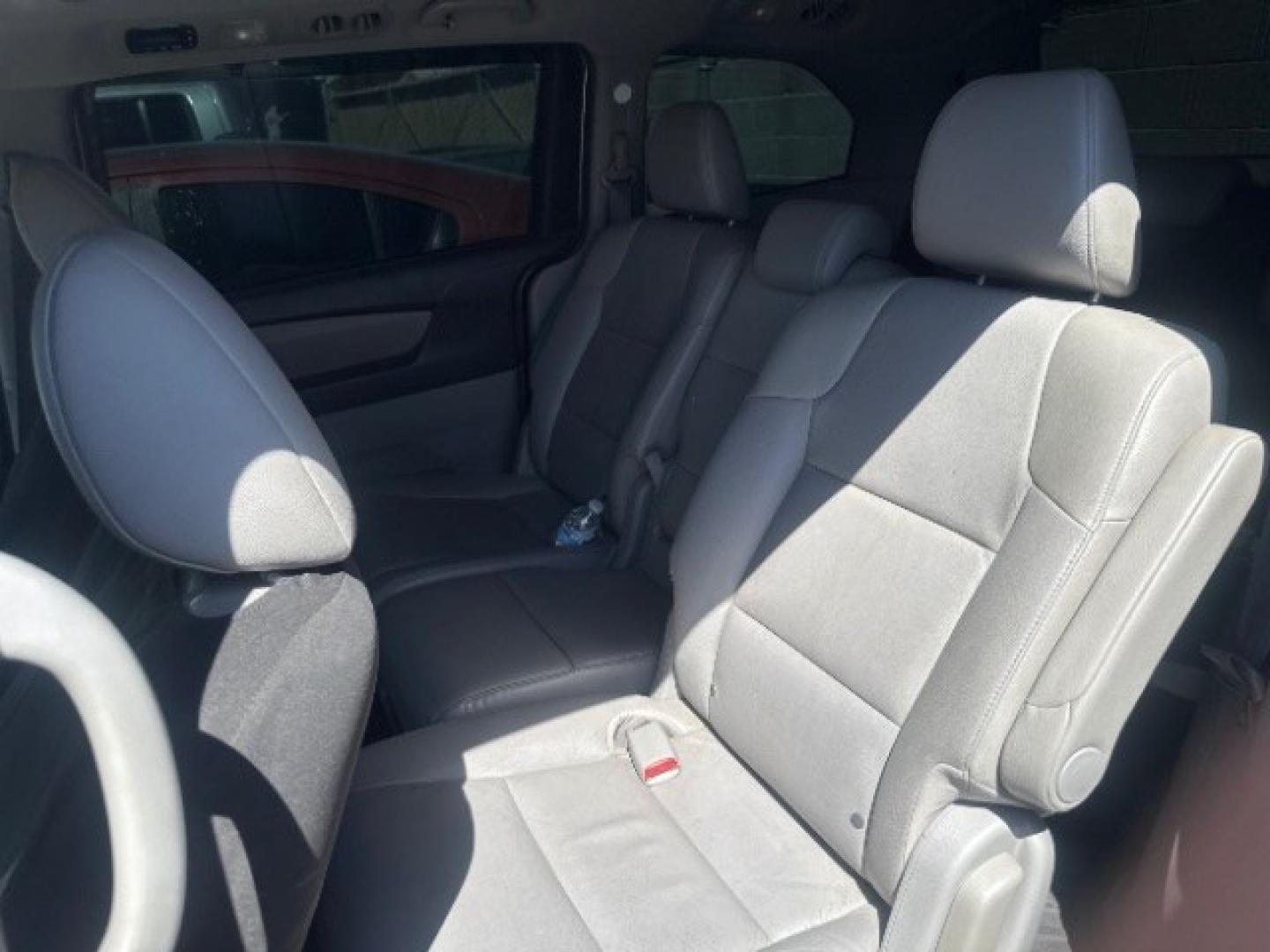2012 Alabaster Silver Metallic /Gray Honda Odyssey EX-L (5FNRL5H6XCB) with an 3.5L V-6 i-VTEC variable valve control engine, Automatic transmission, located at 1865 East Red Hills Pkwy, St. George, 84770, (435) 628-0023, 37.120850, -113.543640 - This vehicle is a Mechanic Special. This means it will need some love. Runs a drives fine but has body damage, leaks or other mechanical issues. It did NOT pass our 50 point inspection. Get a great deal on a less than perfect car. These cars do NOT qualify for our in house financing. Cash and carry,- Photo#3